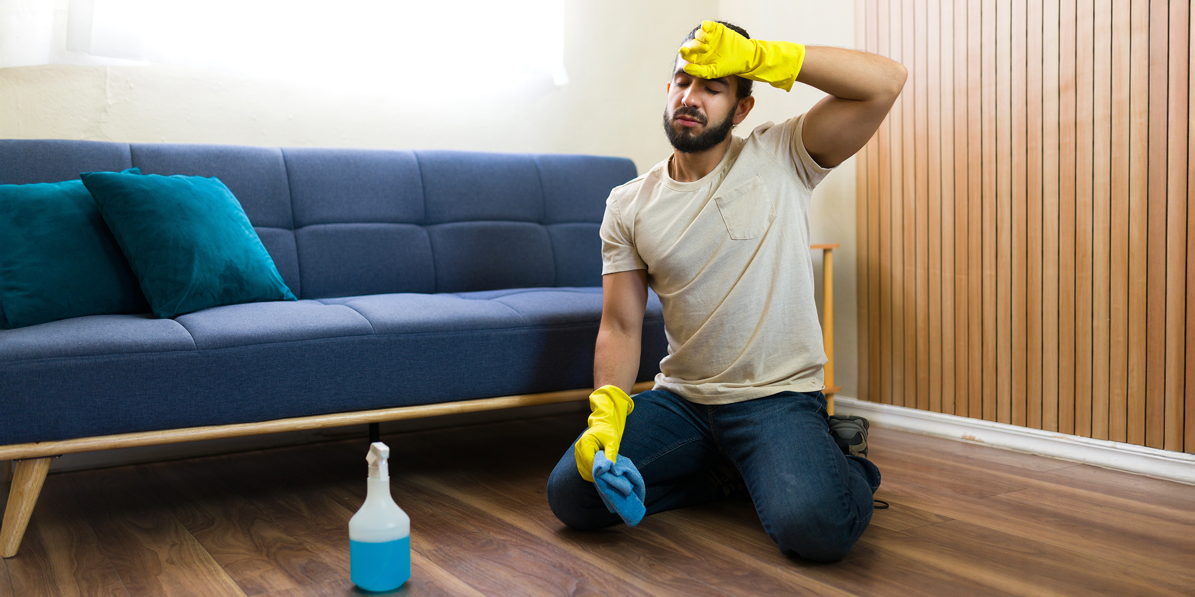 A man cleaning the floor | Source: Shutterstock