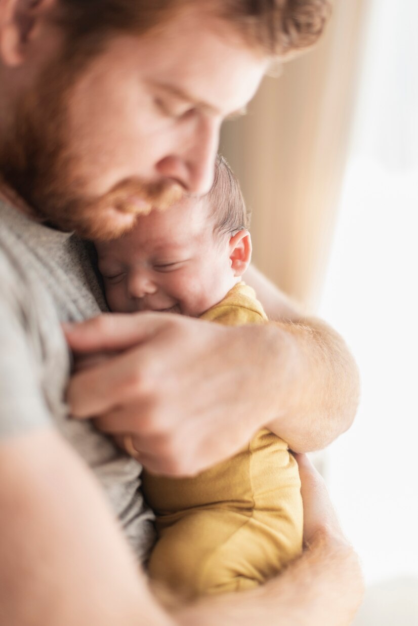 A close-up shot of a father with his baby | Source: Freepik