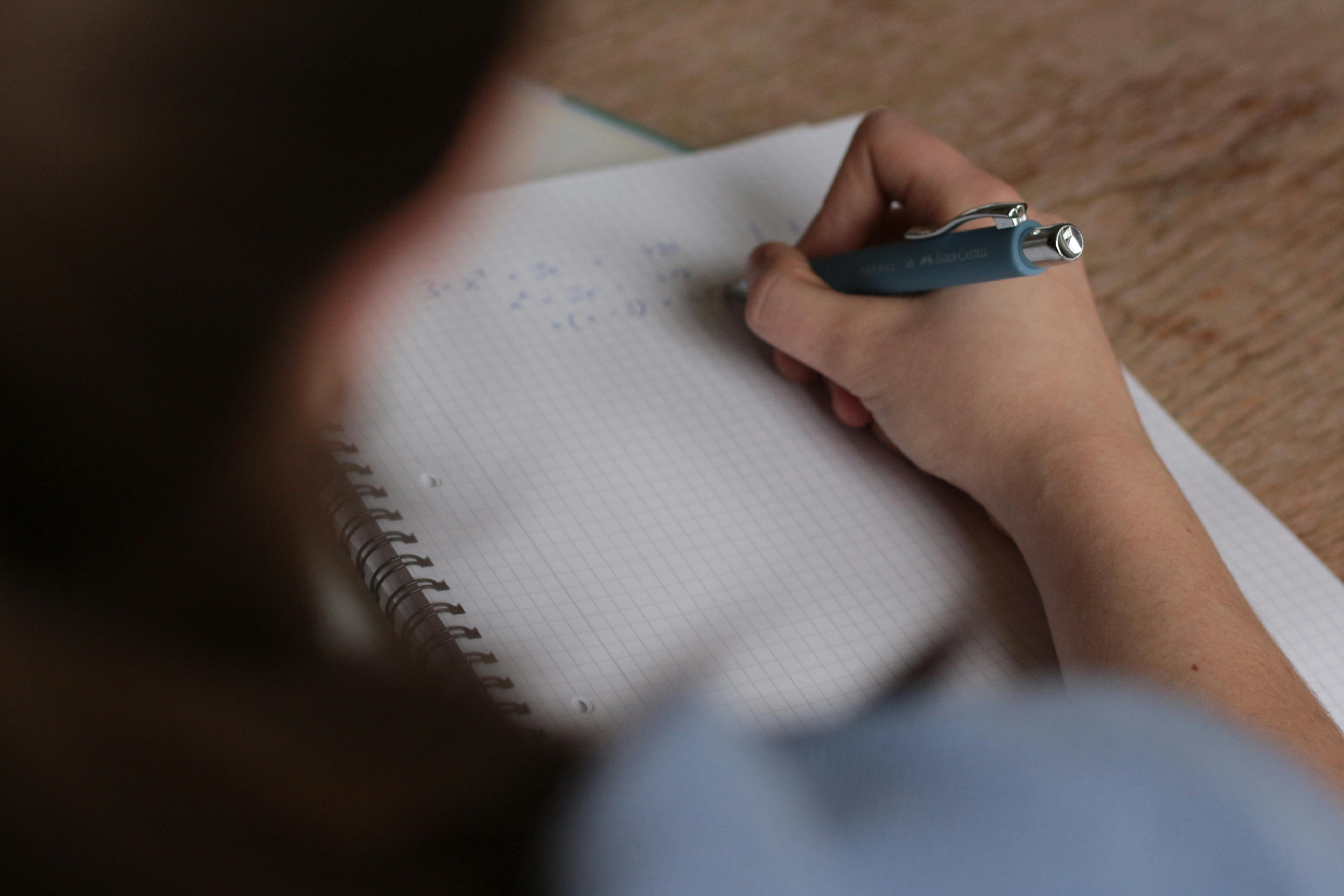 A young woman writing an exam | Source: Pexels