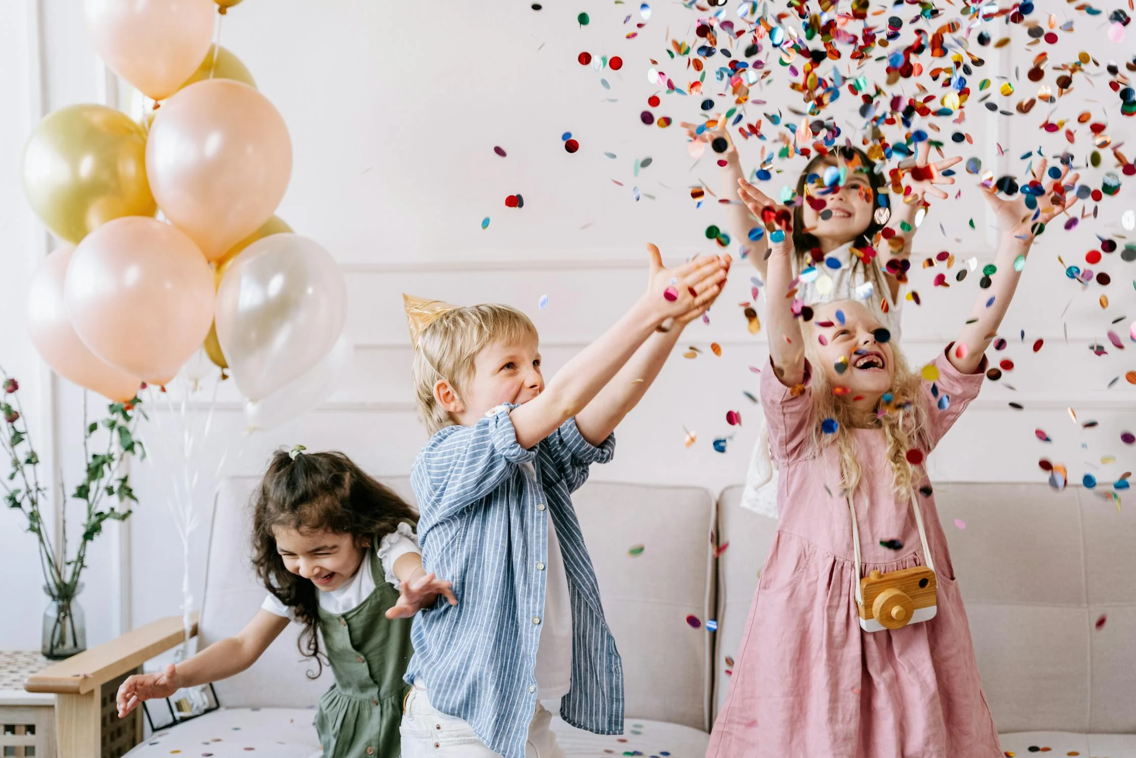 Kids playing in confetti | Source: Pexels