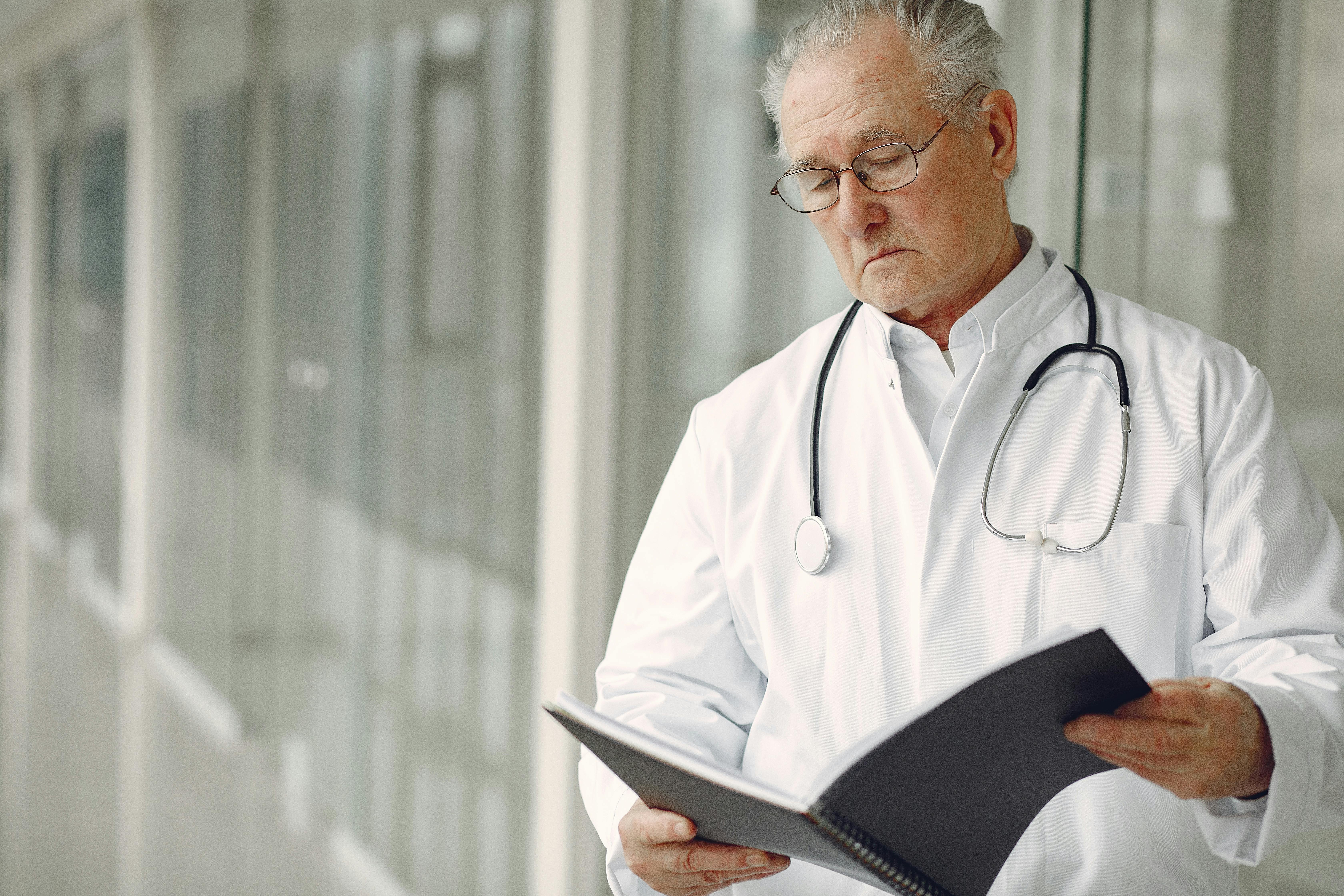 A doctor reading a patient's records | Source: Pexels