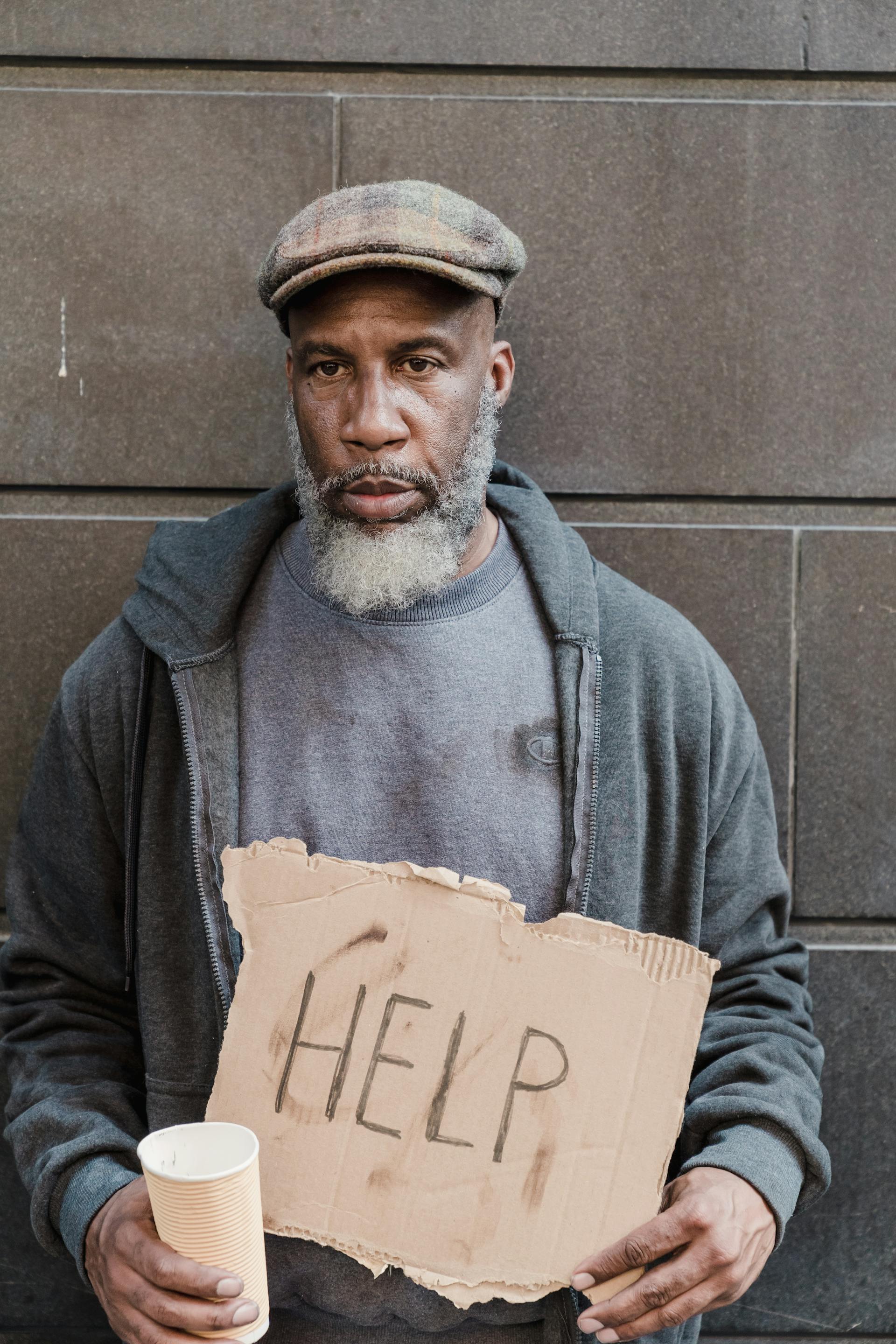 A sad homeless man asking for help | Source: Pexels