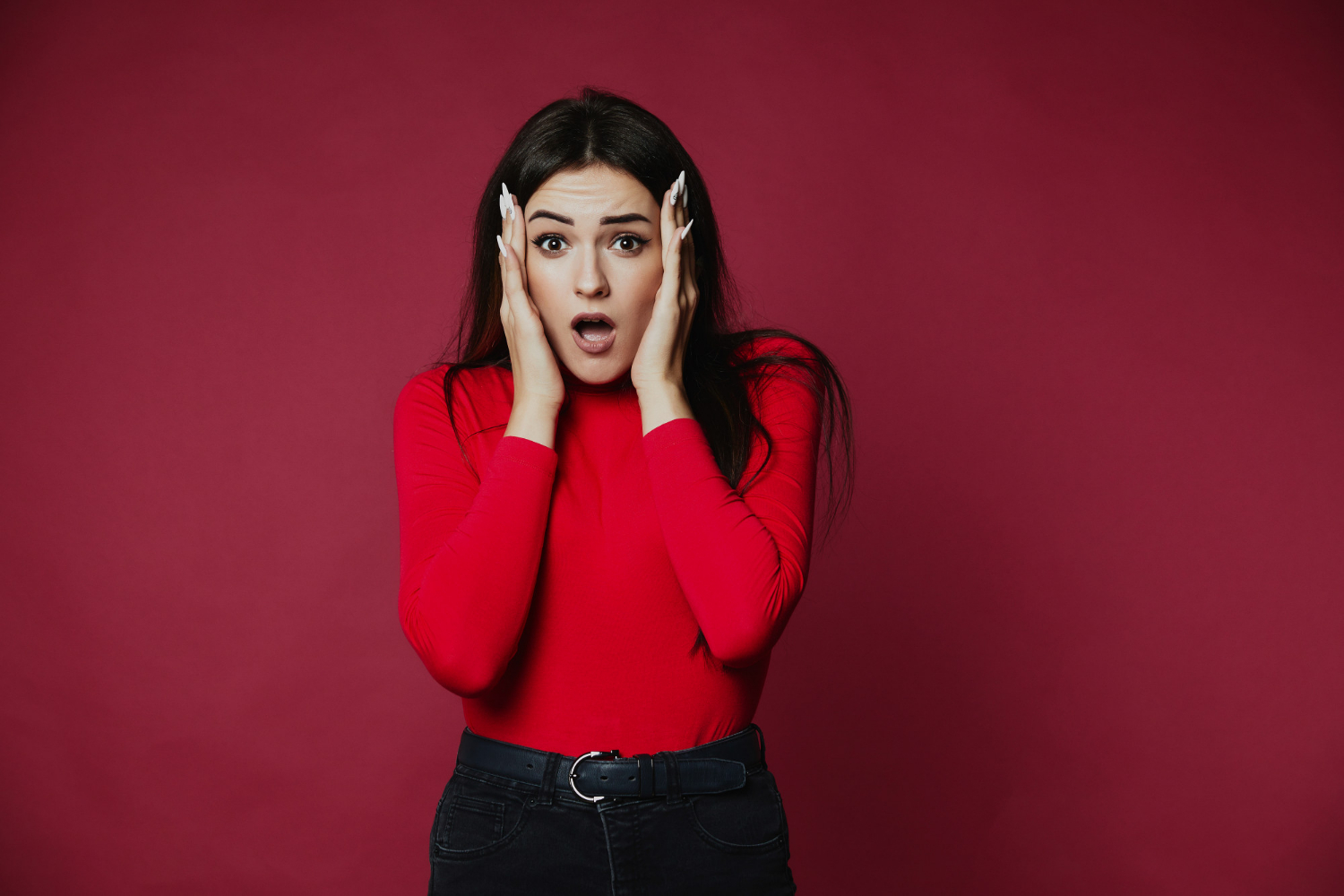 A startled woman | Source: Freepik