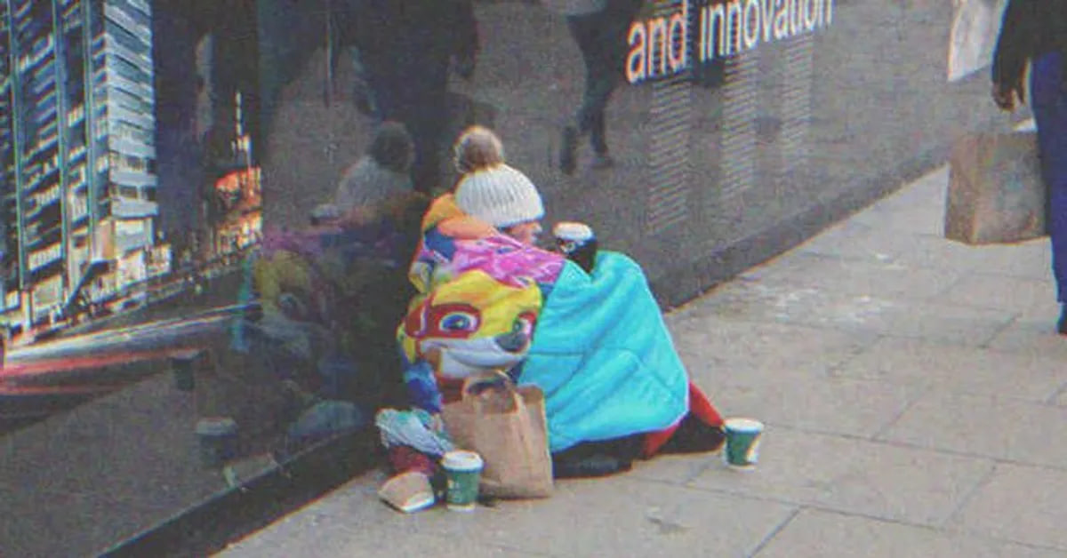 Homeless woman sitting on the street | Source: Shutterstock