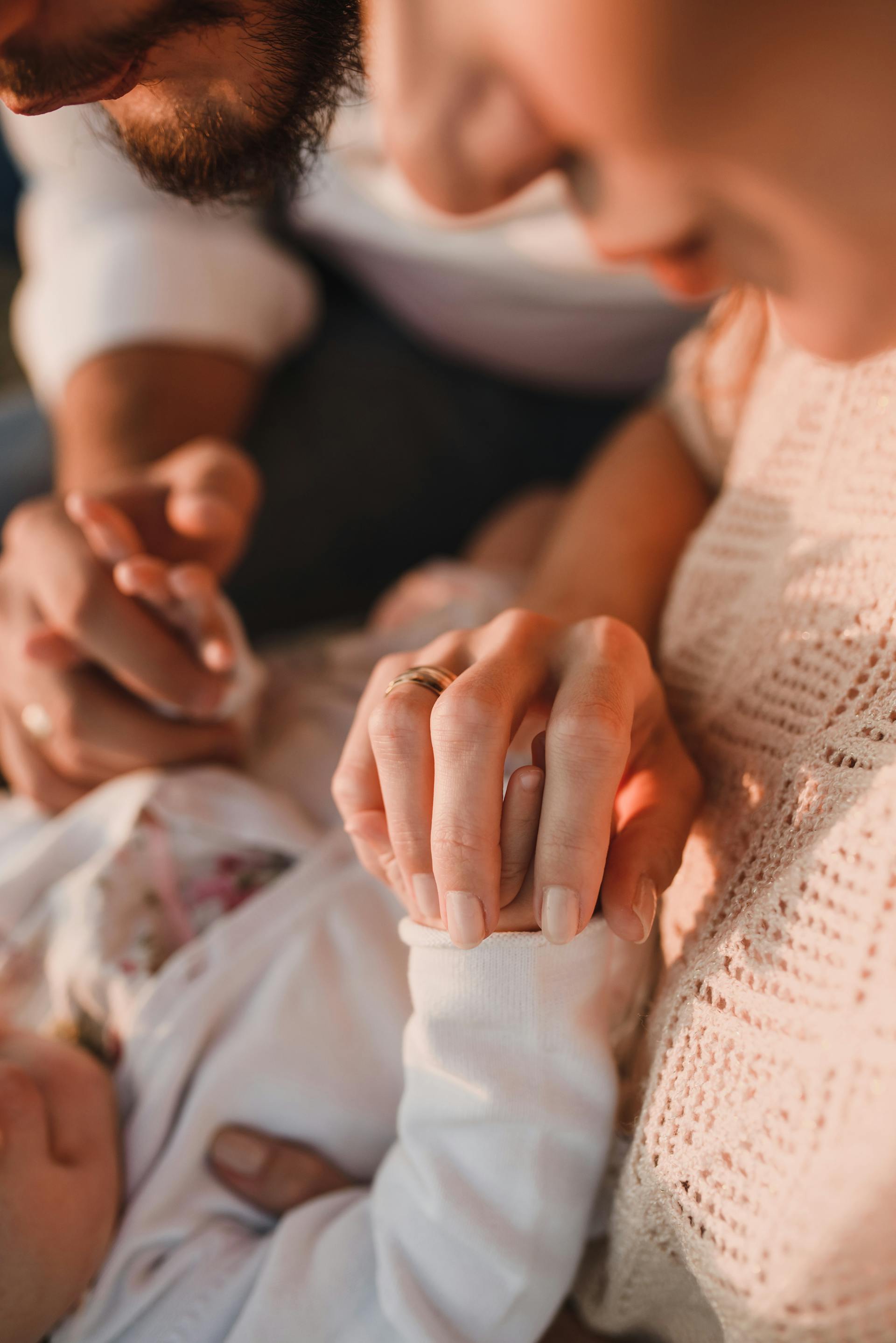 Close up of a man and woman with a baby | Source: Pexels