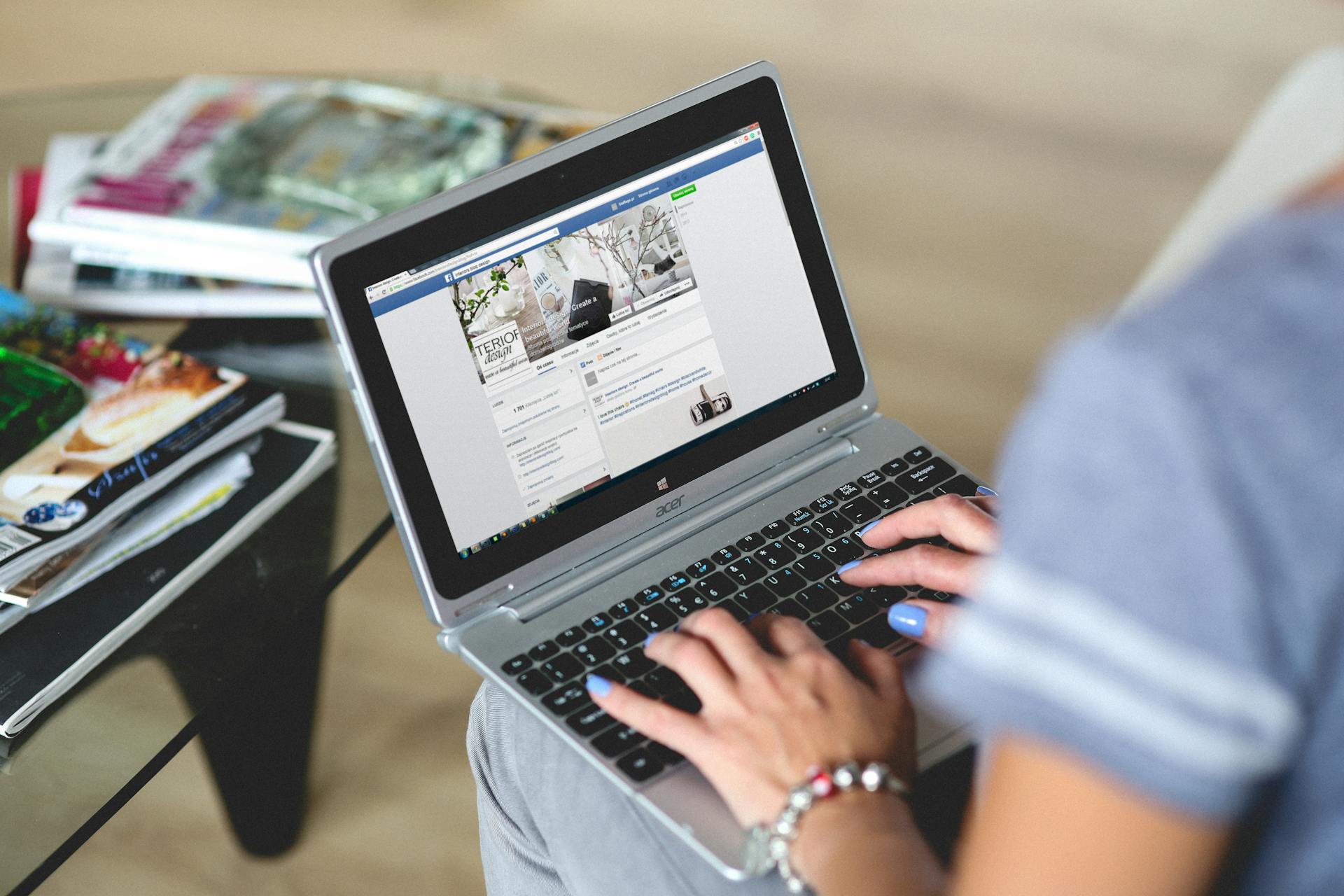 Using facebook on a laptop | Source: Pexels