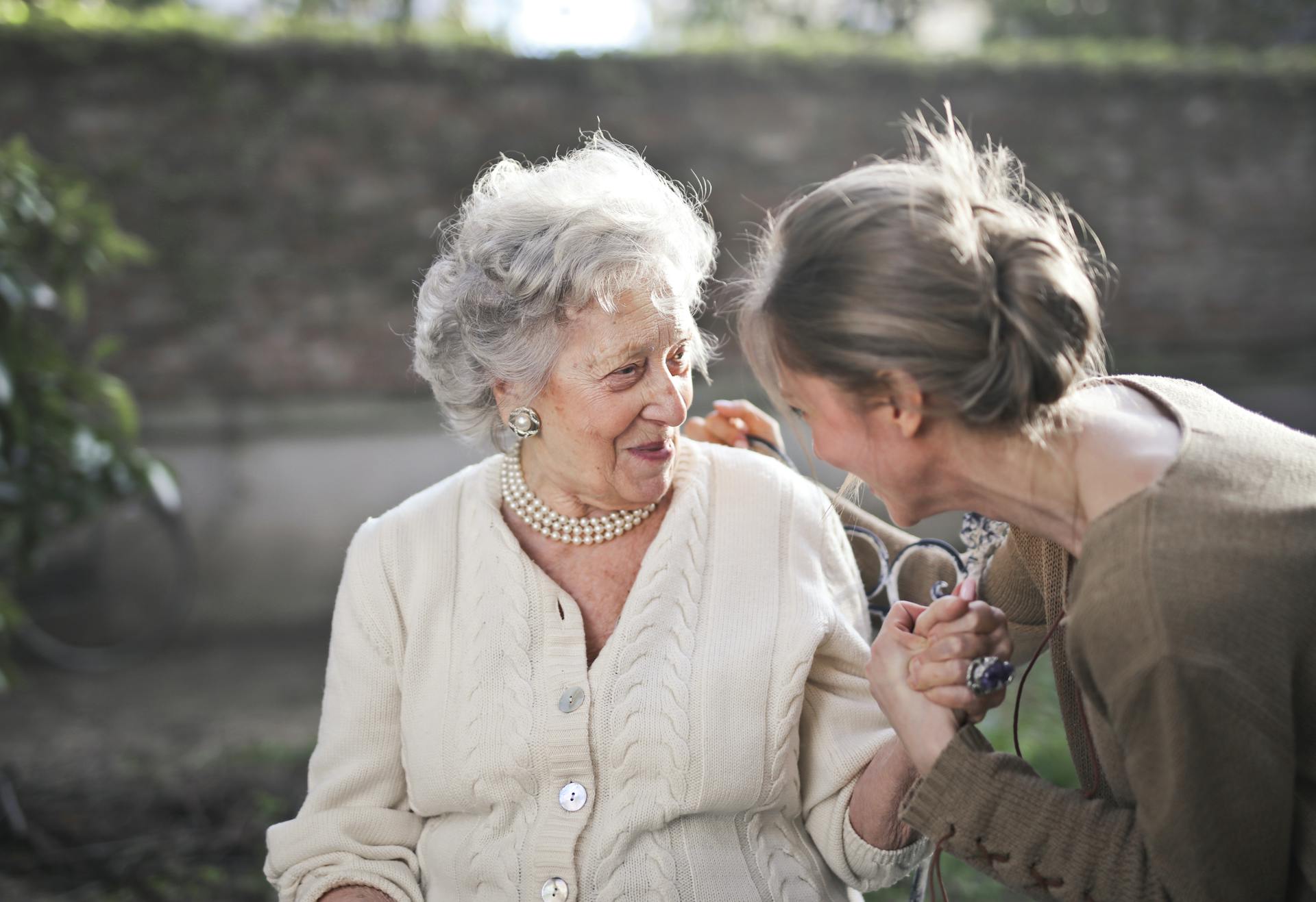 A delighted elderly woman looking at a young lady | Source: Pexels