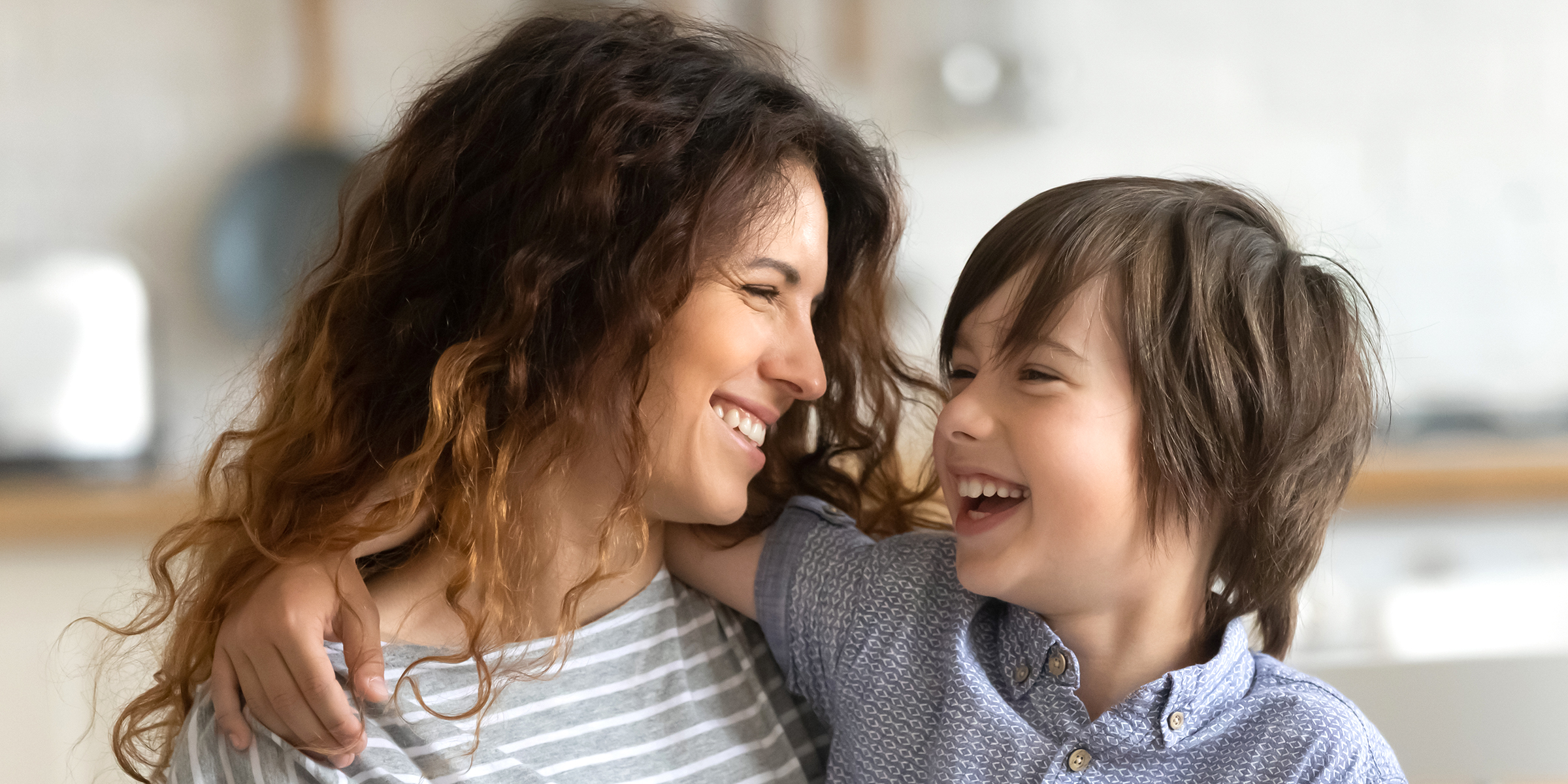 A smiling woman and child | Source: Shutterstock