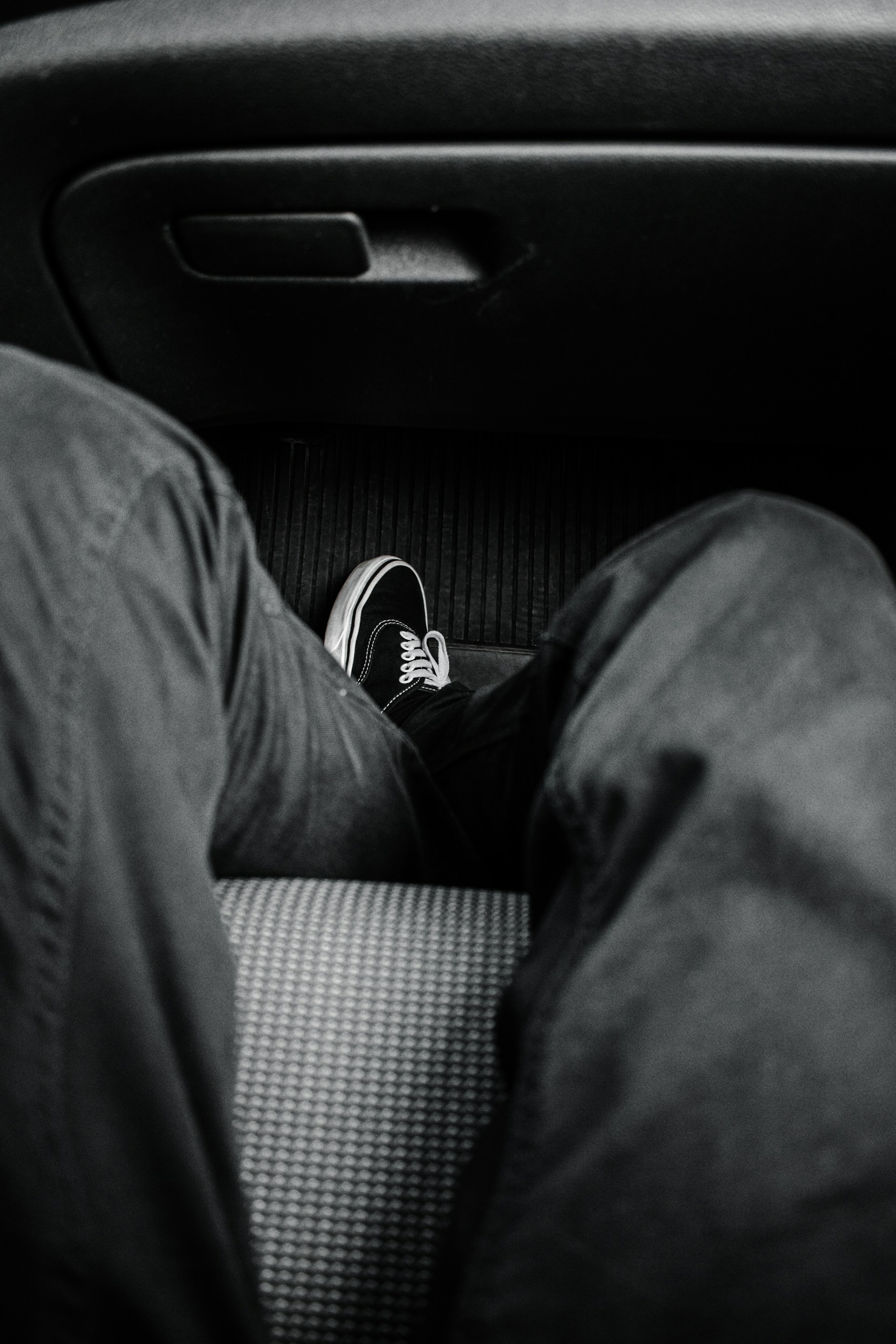 Close-up shot of a person sitting in a car | Source: Unsplash