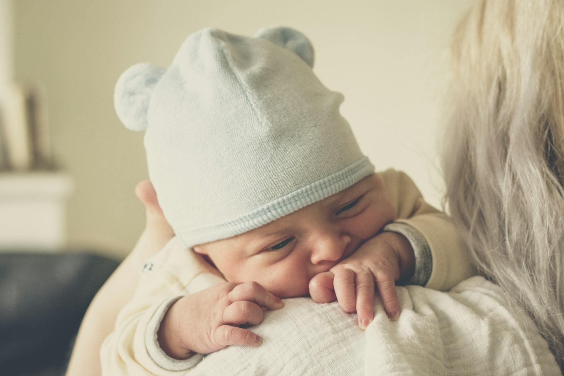 A mother carrying her baby | Source: Unsplash