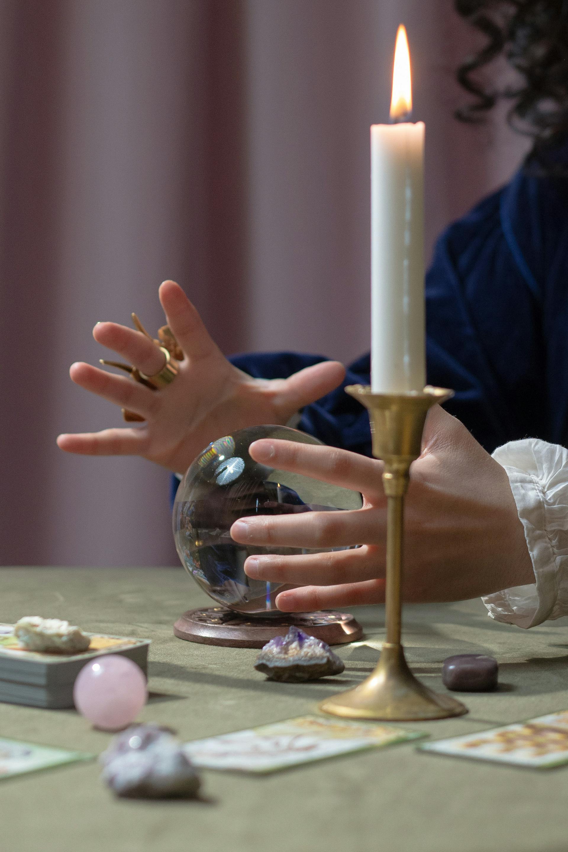 A fortune-teller gazing into a crystal ball | Source: Pexels