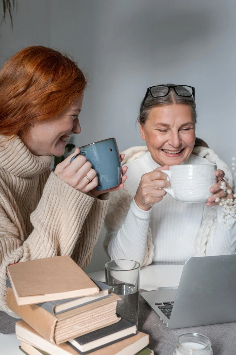 A woman drinking tea with her daughter | Source: Pexels