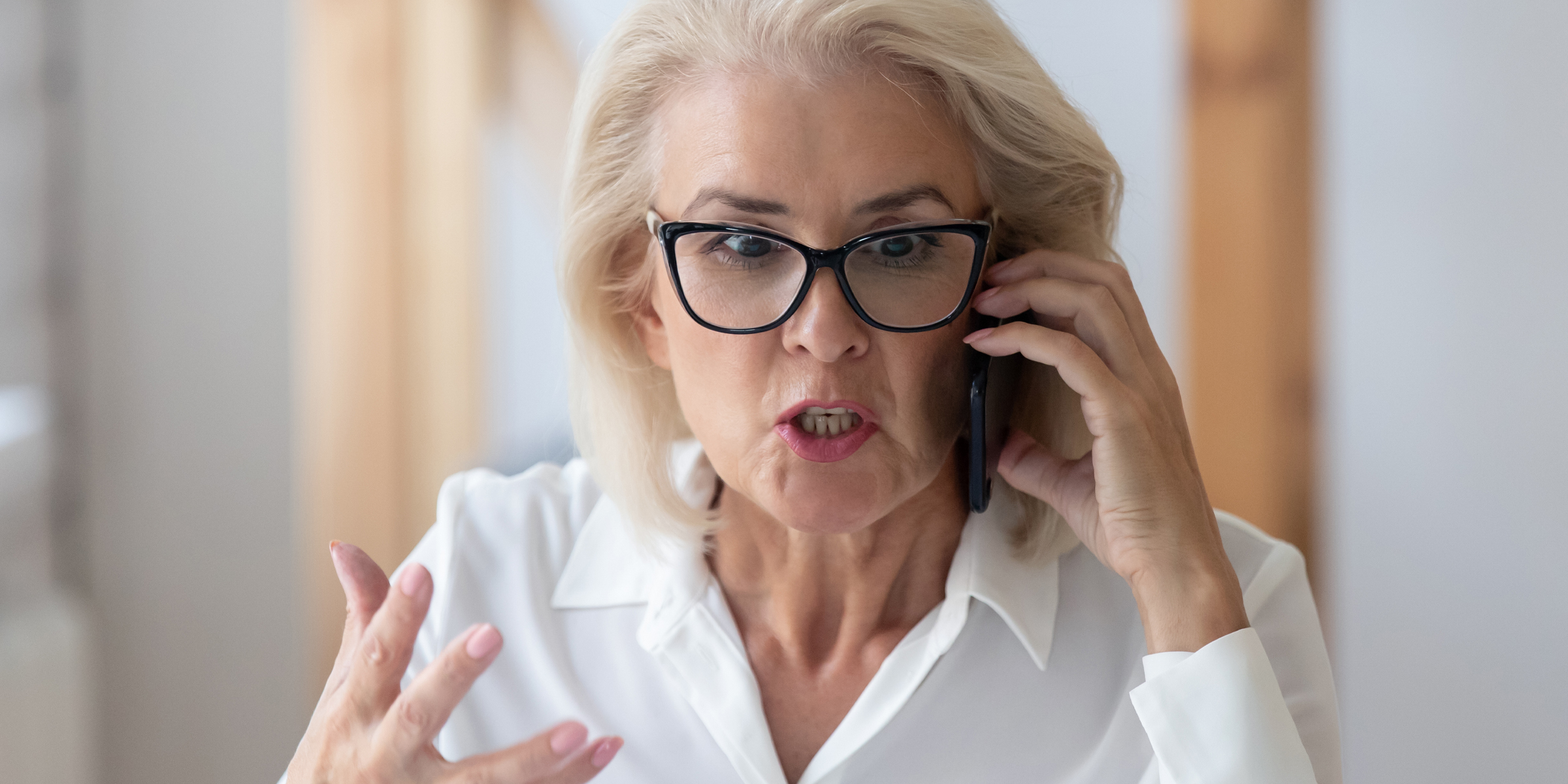 A woman speaking angrily during a phone call | Source: Shutterstock