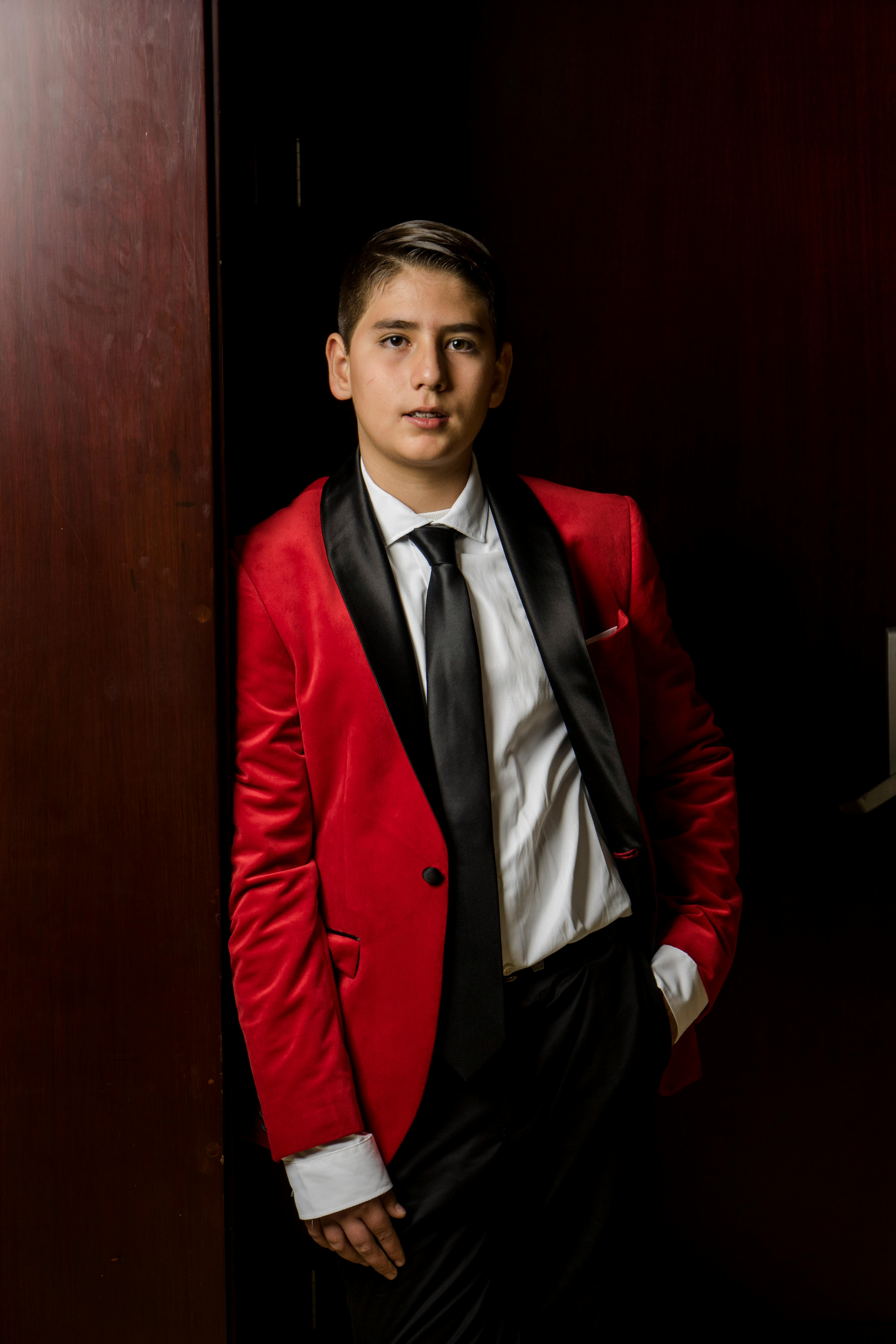 Boy in a red tuxedo | Source: Pexels
