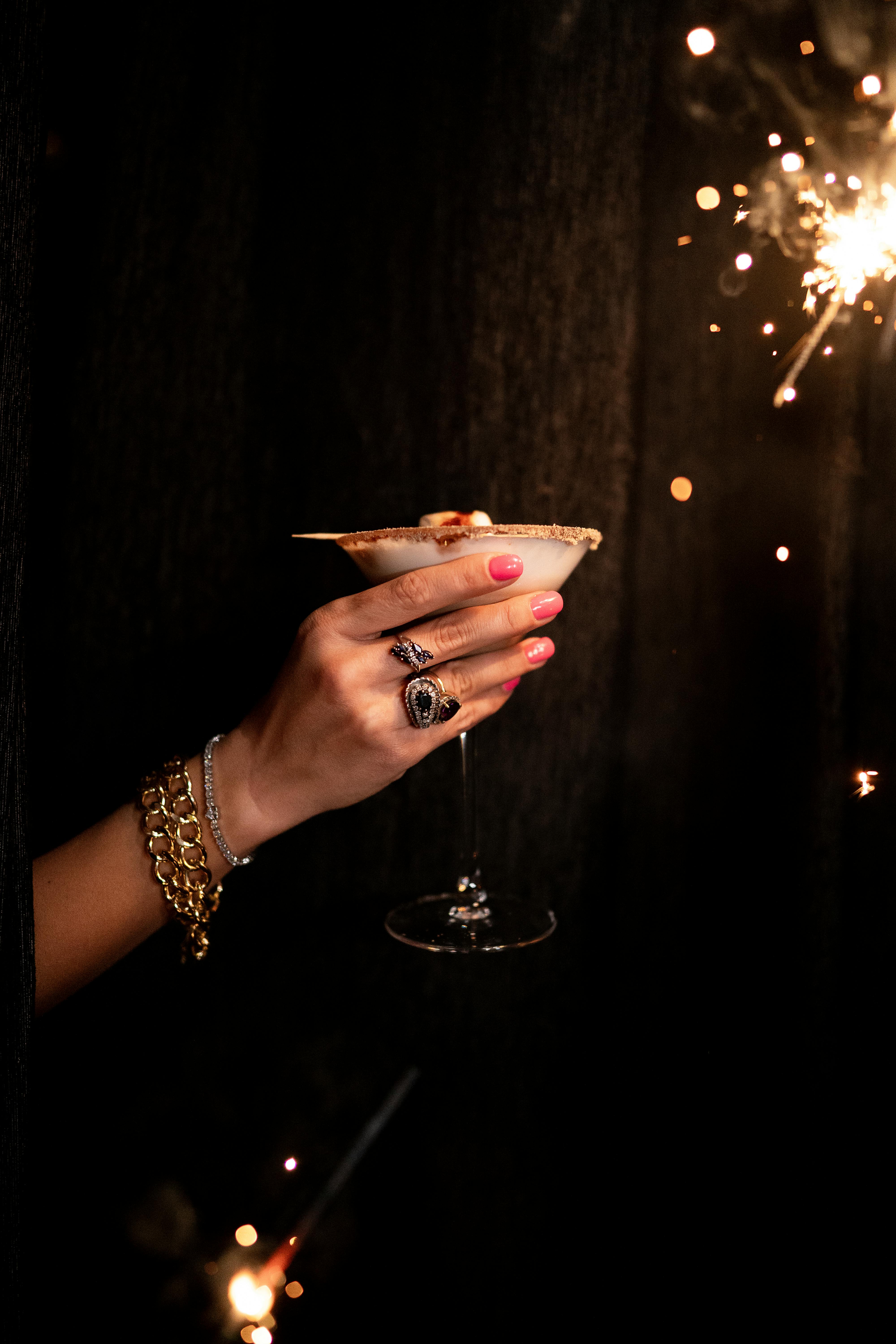 A woman raising a toast at a party | Source: Pexels