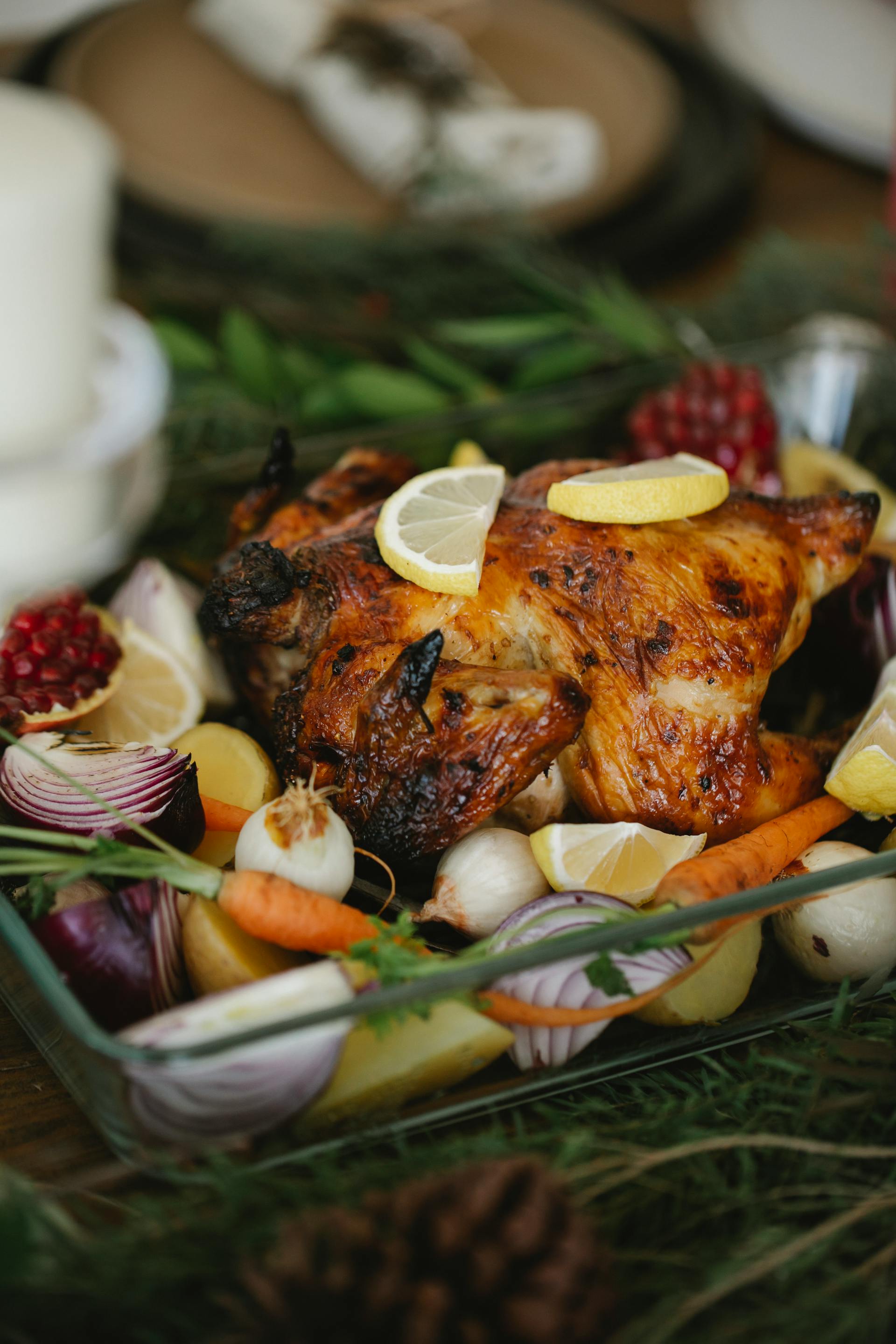 A photo showing roasted chicken served in a dish with vegetables | Source: Pexels