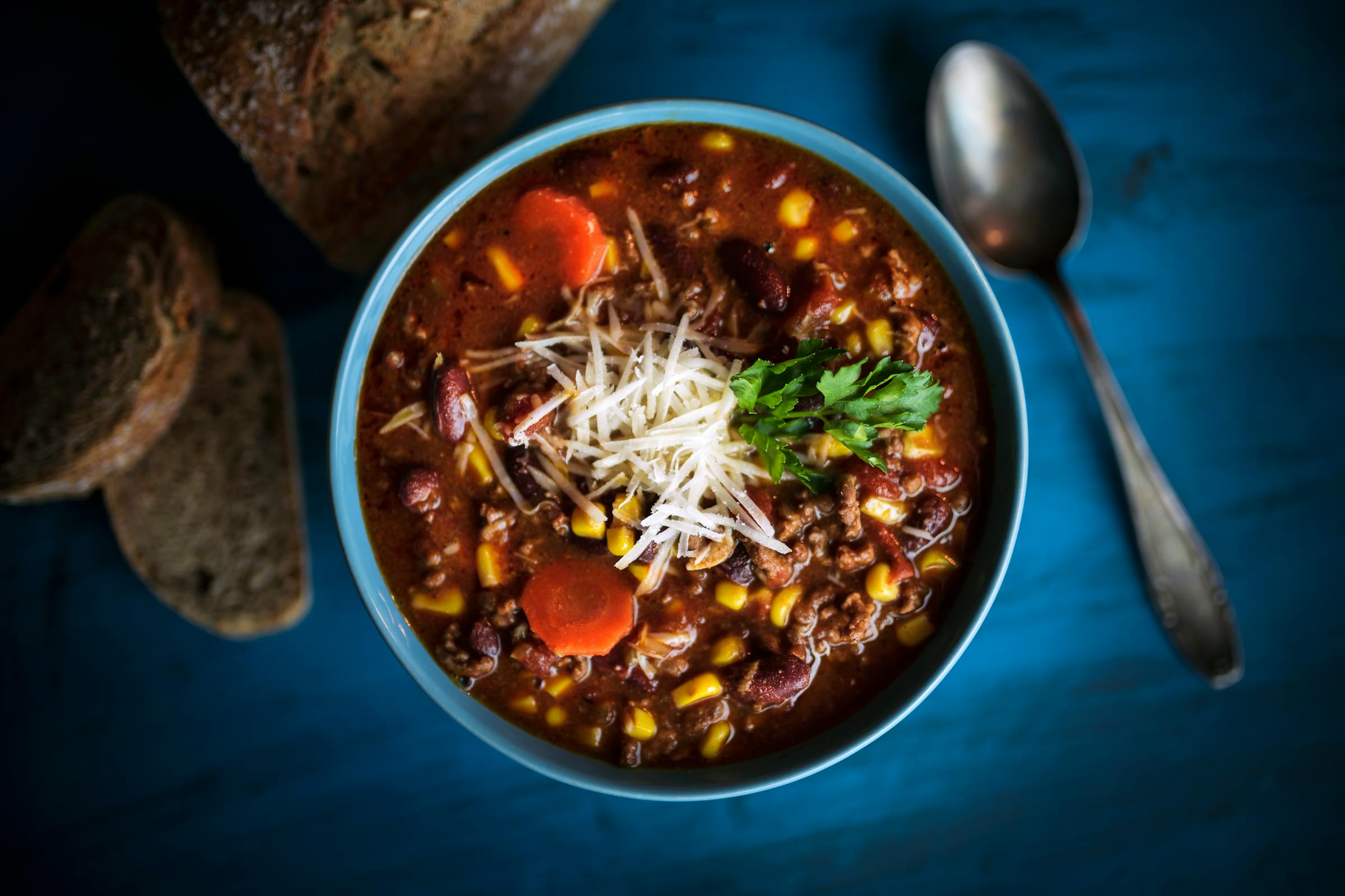 A bowl of food sitting on a table | Source: Pexels