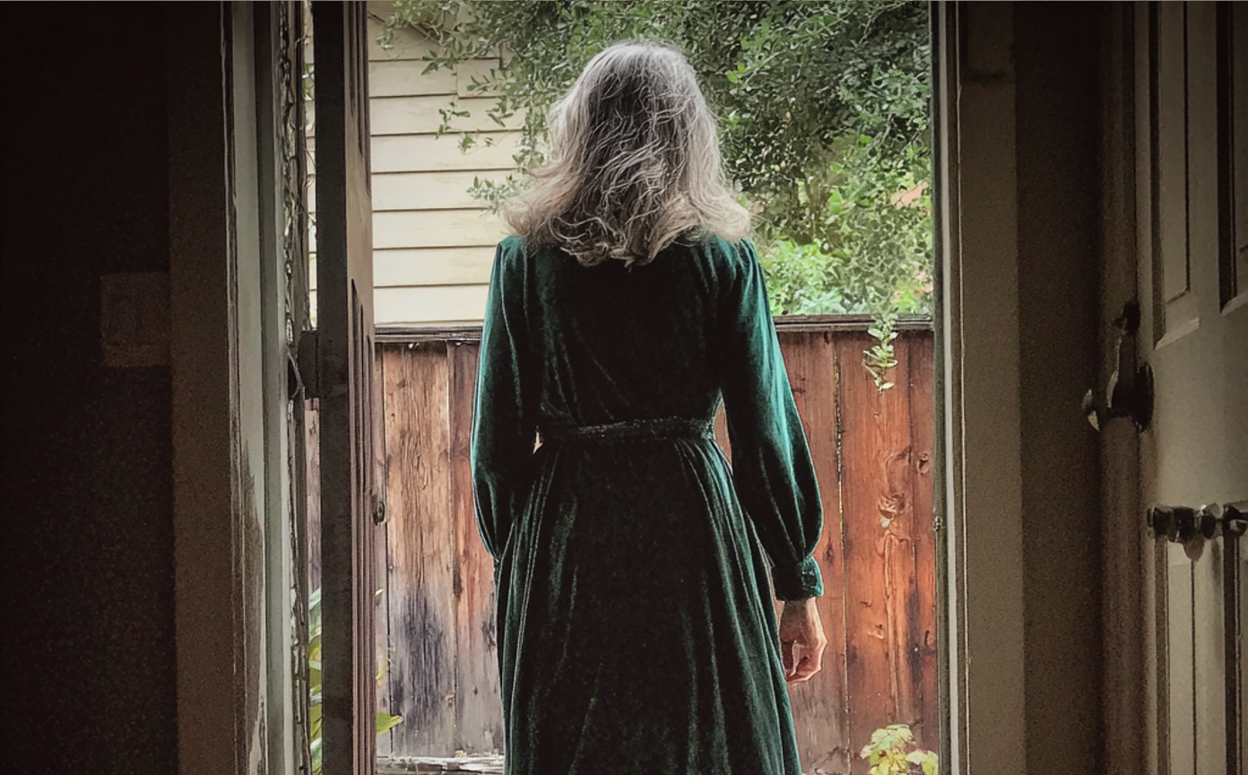 A woman walking out of a house | Source: Midjourney