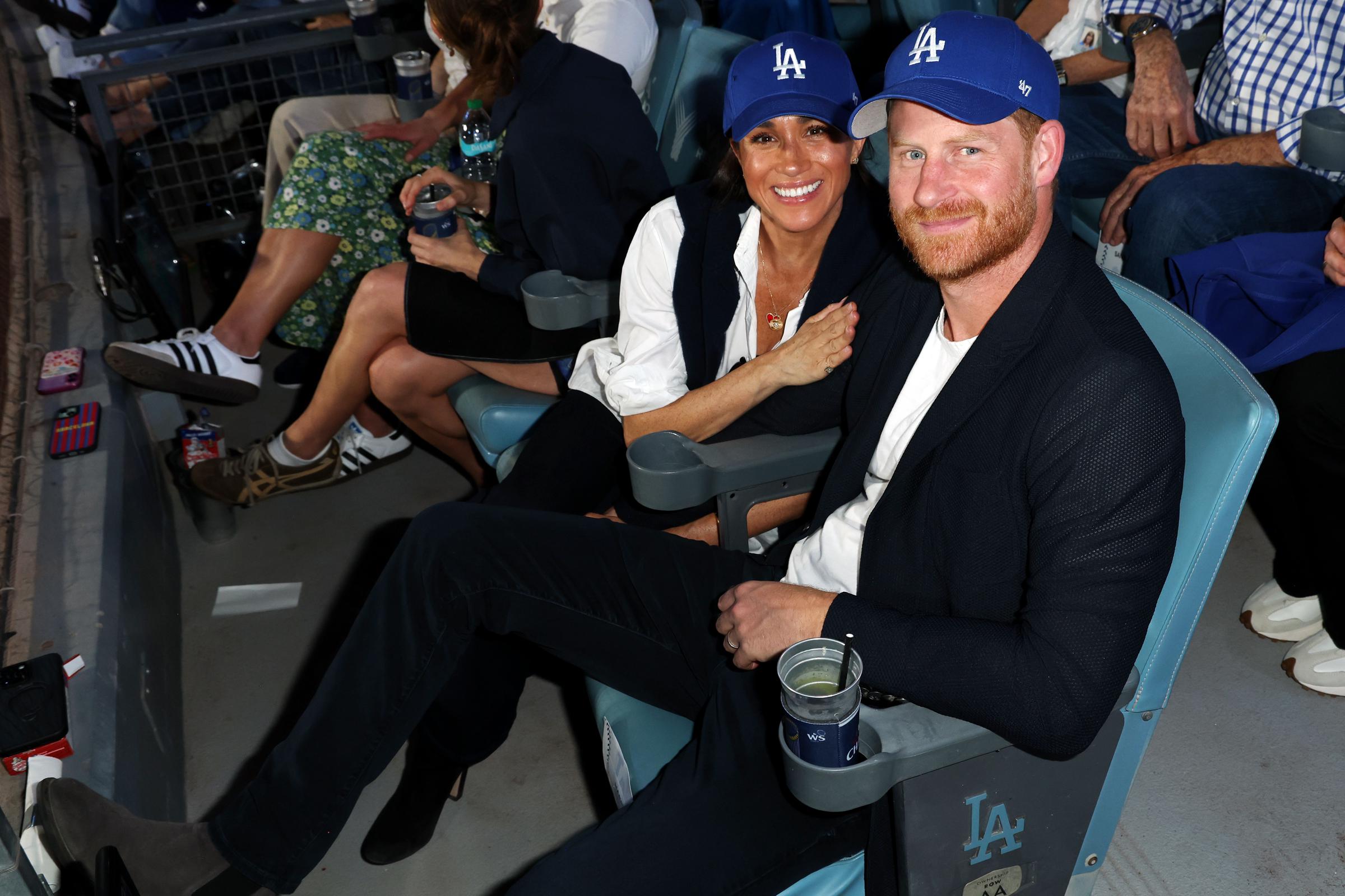 Prince Harry, Duke of Sussex and Meghan, Duchess of Sussex pose for a photo during Game Four of the 2025 World Series presented by Capital One between the Toronto Blue Jays and the Los Angeles Dodgers at Dodger Stadium on Tuesday, October 28, 2025 in Los Angeles, California. | Source: Getty Images