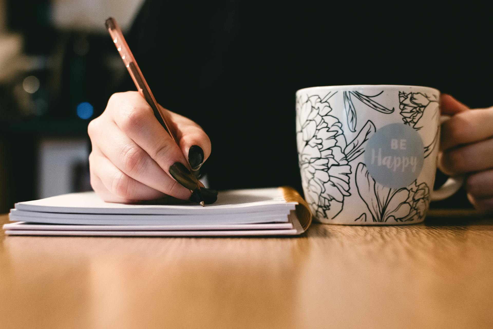 A woman writing in a notebook | Source: Pexels