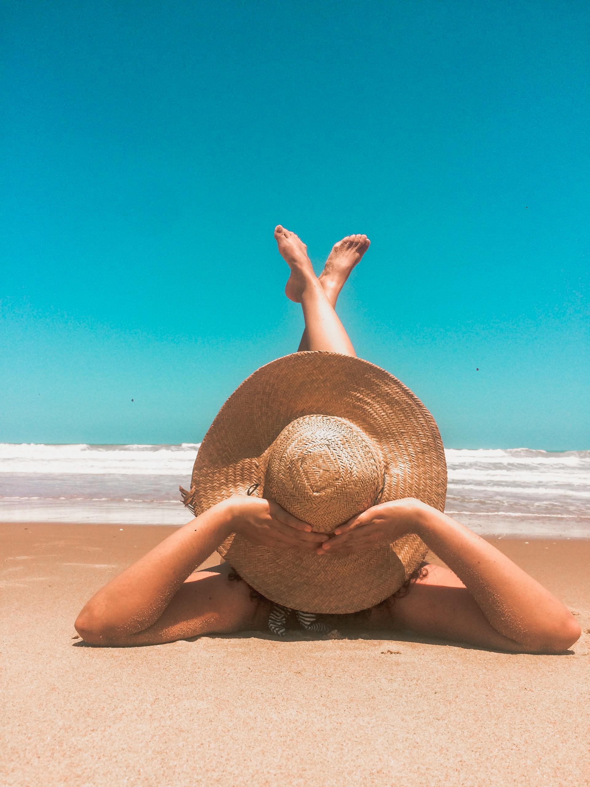 A woman relaxing on a beach | Source: Pexels