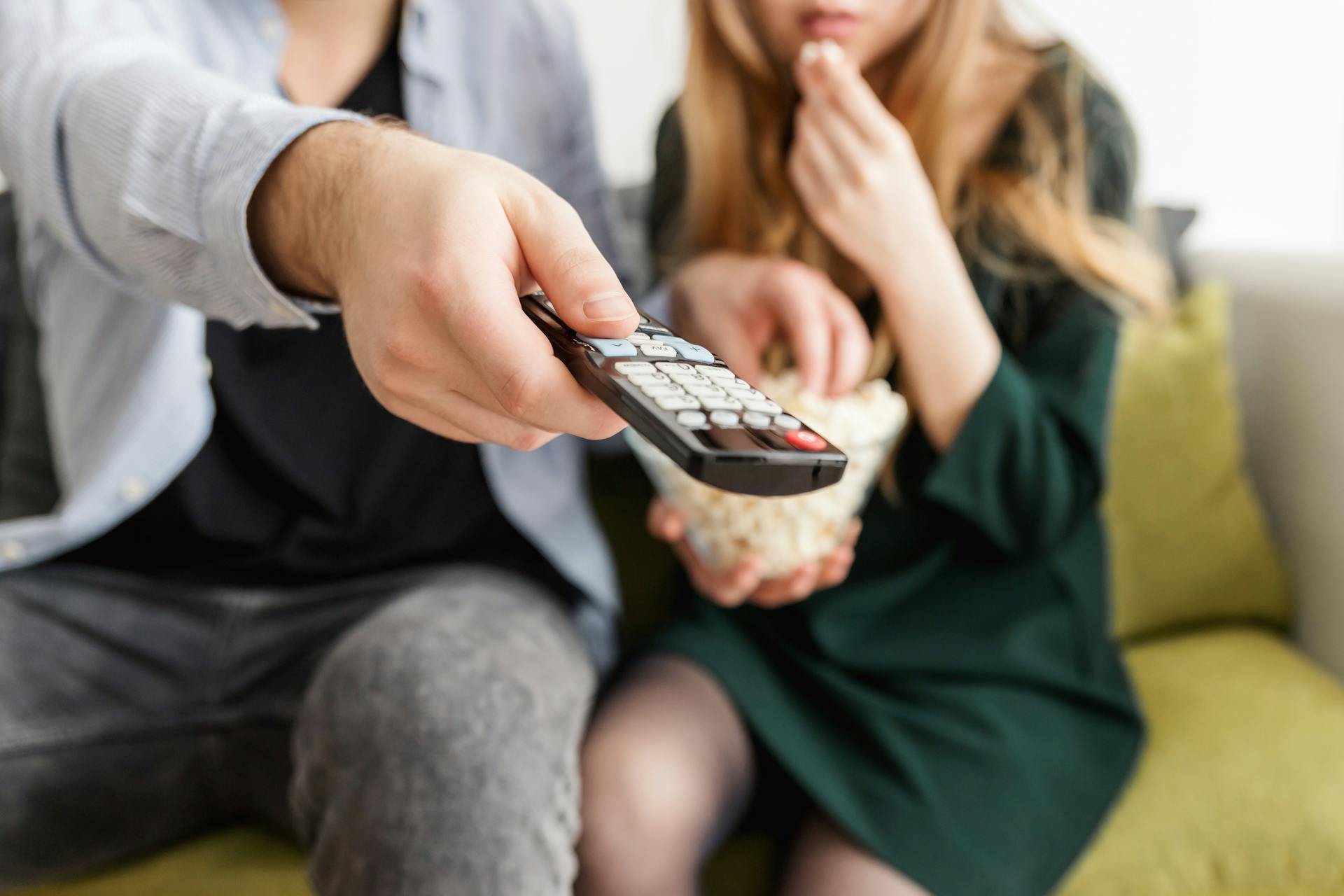 A couple sitting on a sofa together | Source: Pexels