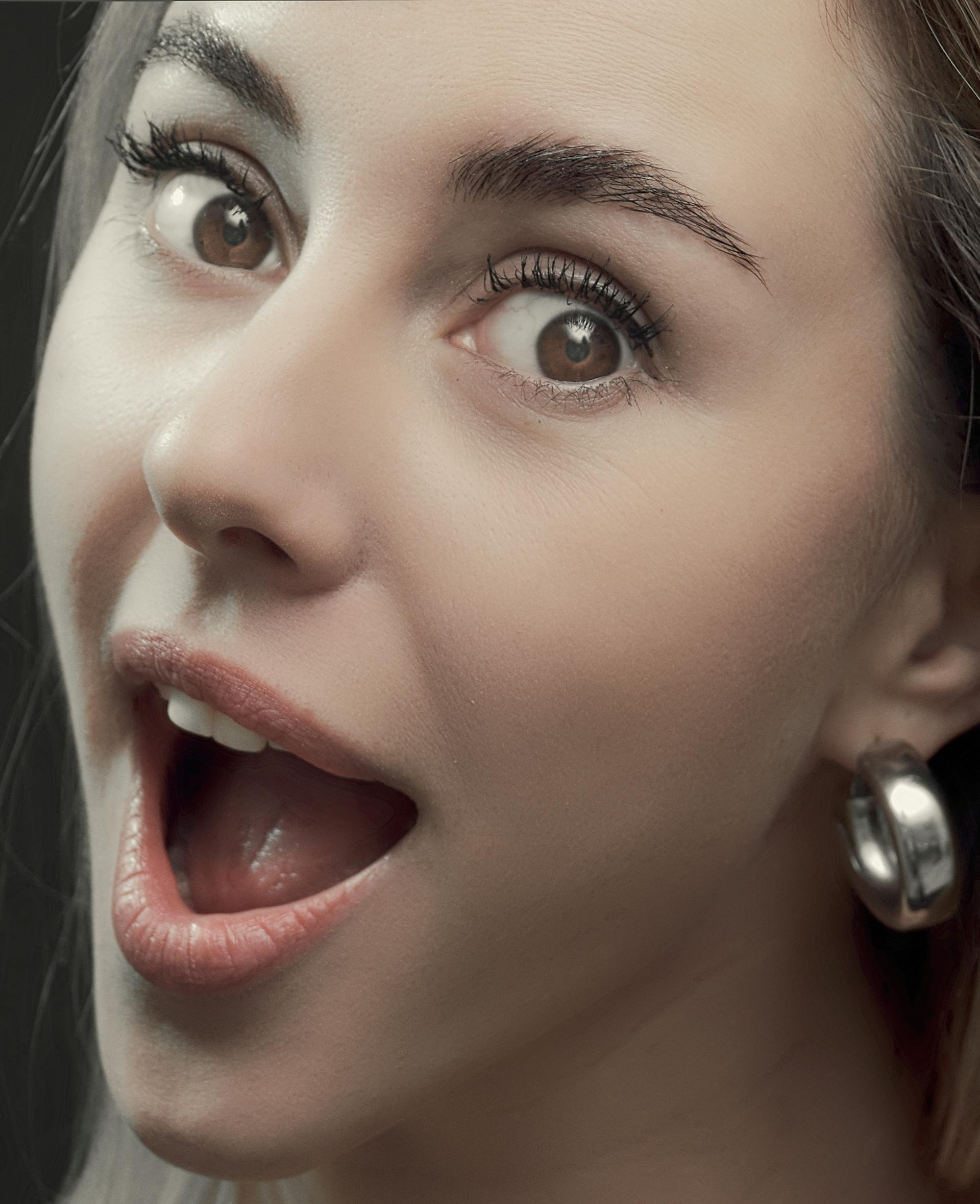 A woman gasping in surprise | Source: Pexels