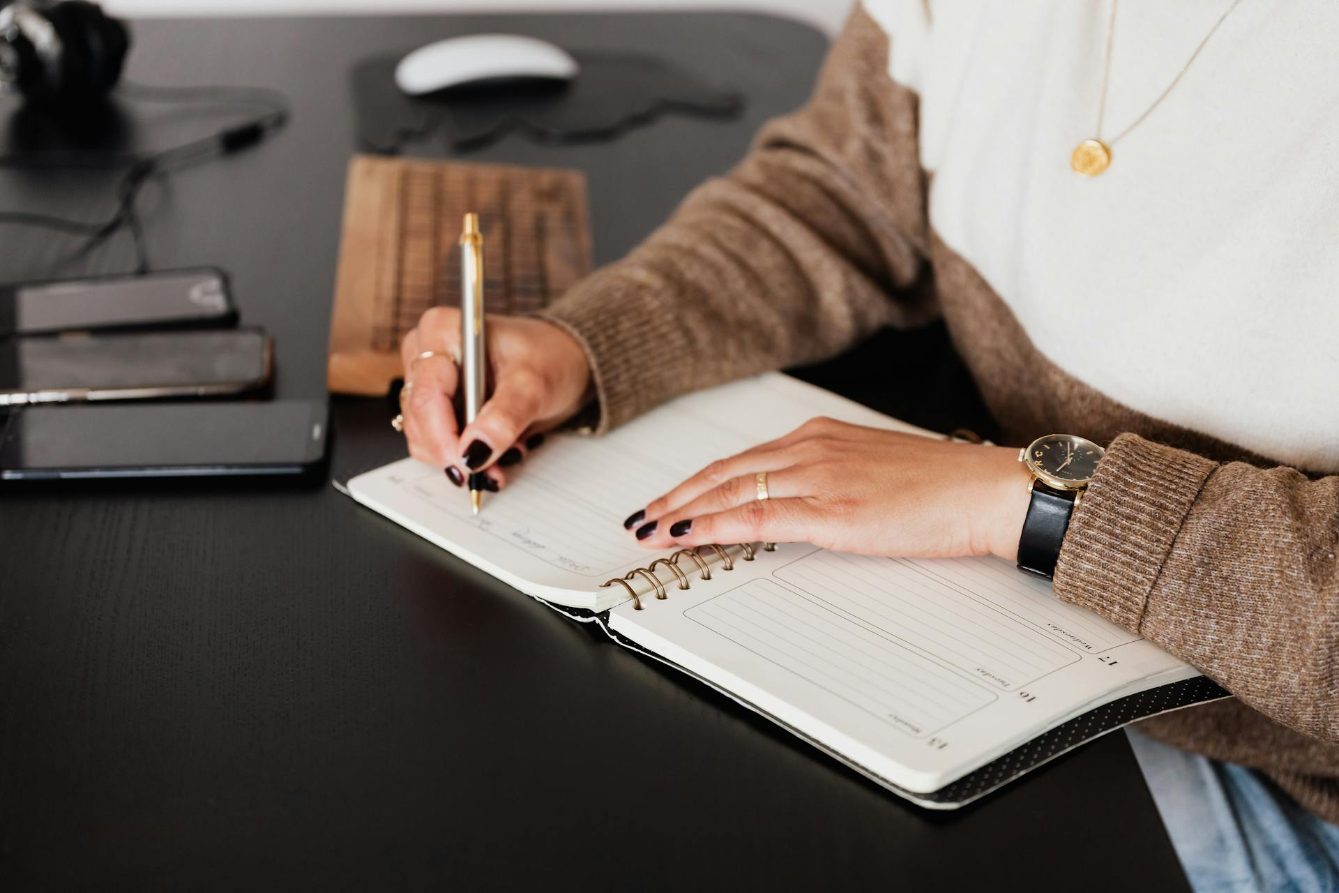 A woman writing in her diary | Source: Pexels