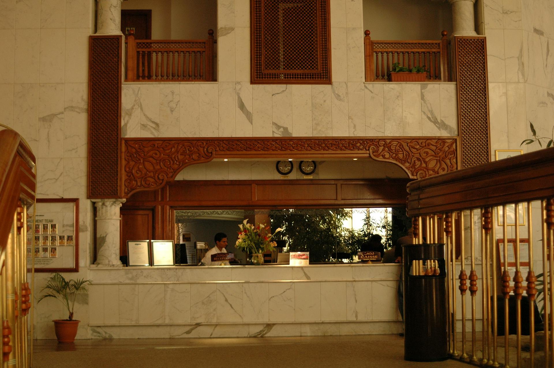 The reception desk in a hotel lobby | Source: Pexels