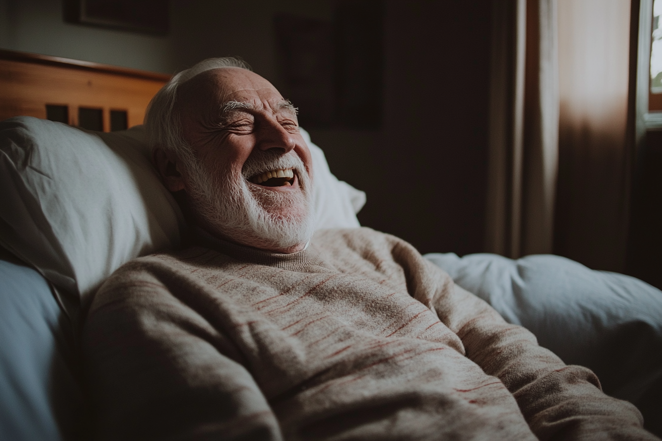 An elderly man in bed laughing | Source: Midjourney