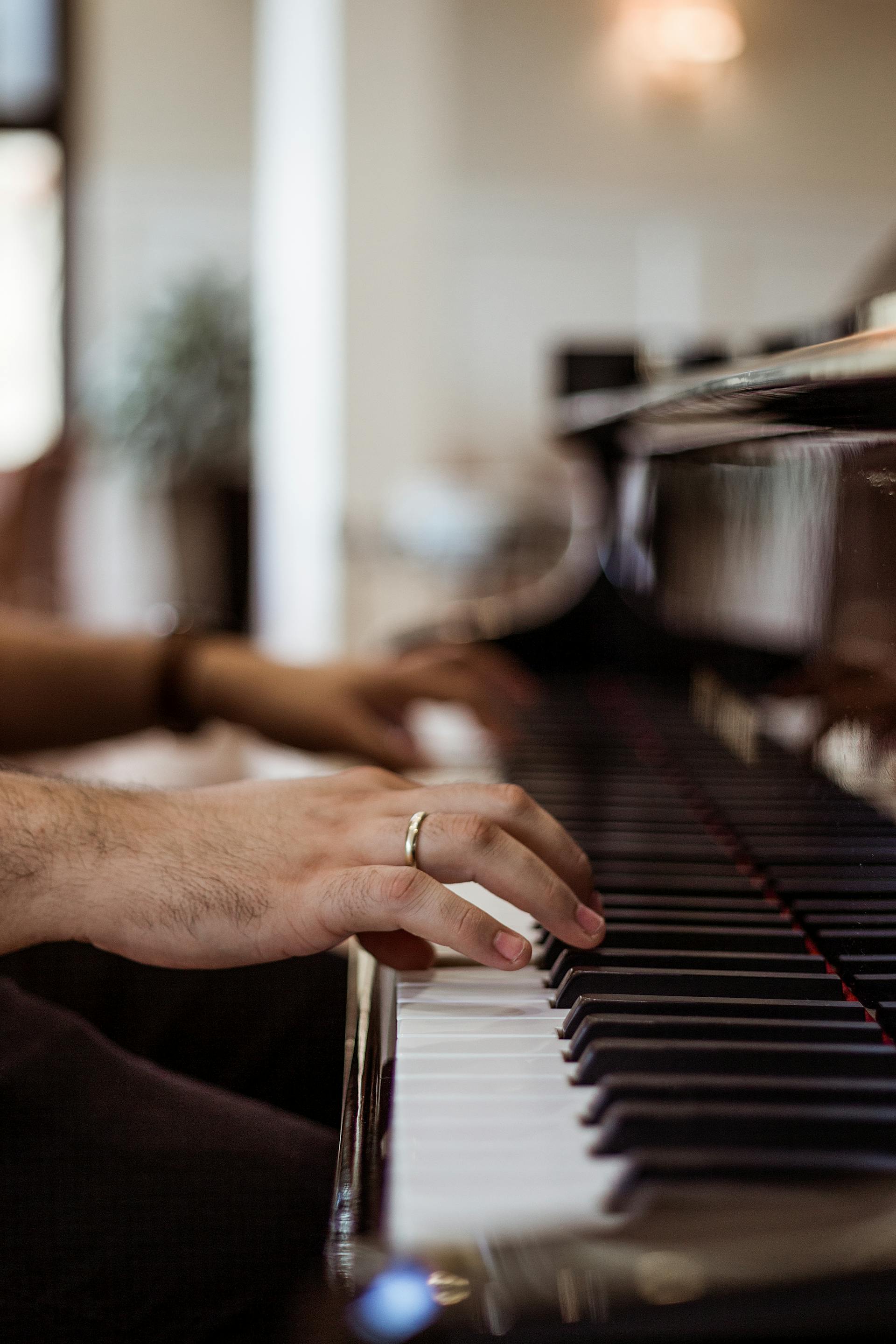 Close up of a man's hands while playing piano | Source: Pexels