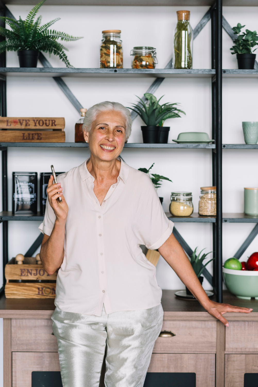 An older woman laughing | Source: Freepik