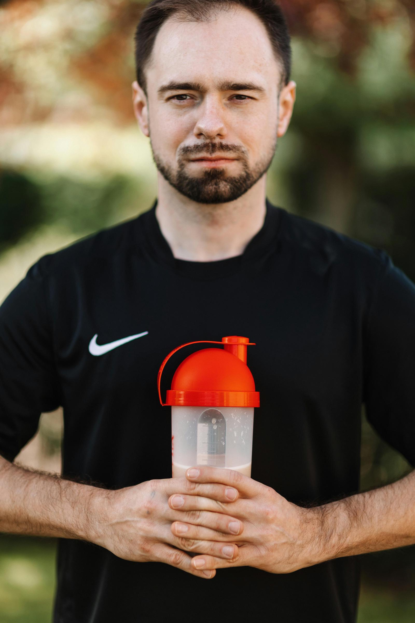 A man holding a protein shake | Source: Pexels