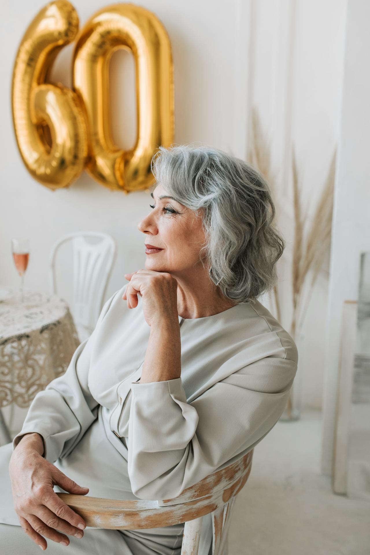 A senior woman sitting on a chair | Source: Pexels