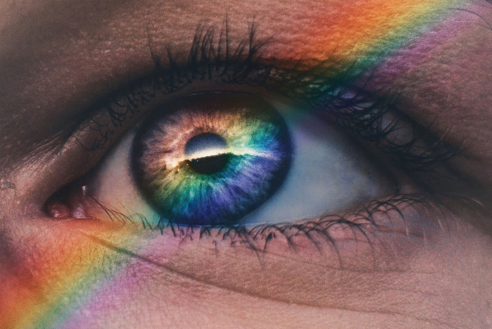 A rainbow shining over someone's eye | Source: Unsplash