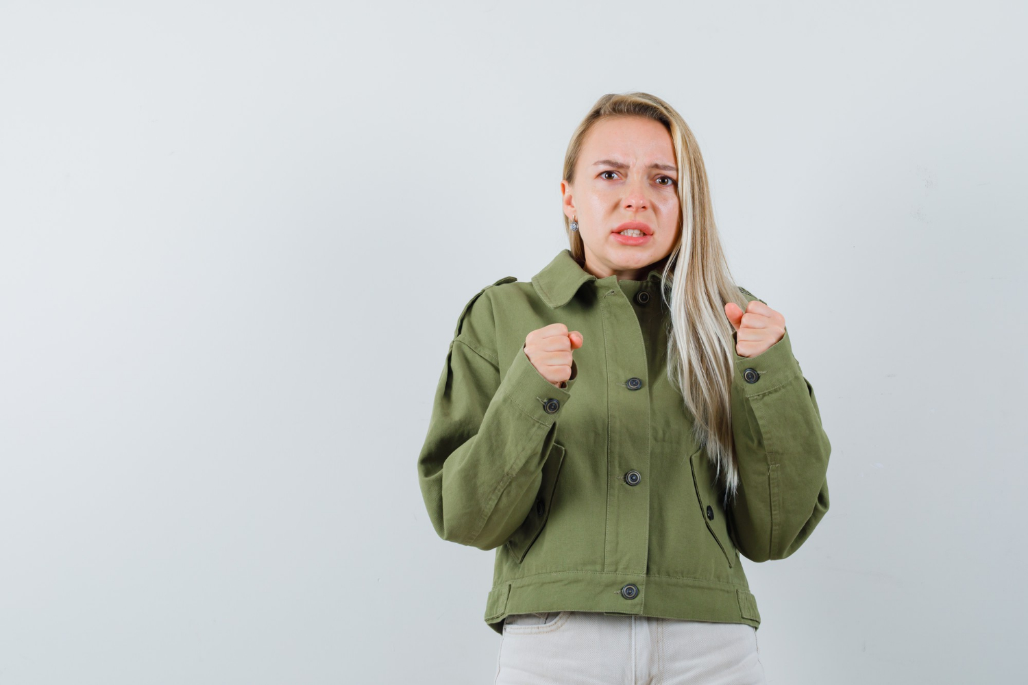 A furious woman with her fists clenched | Source: Freepik