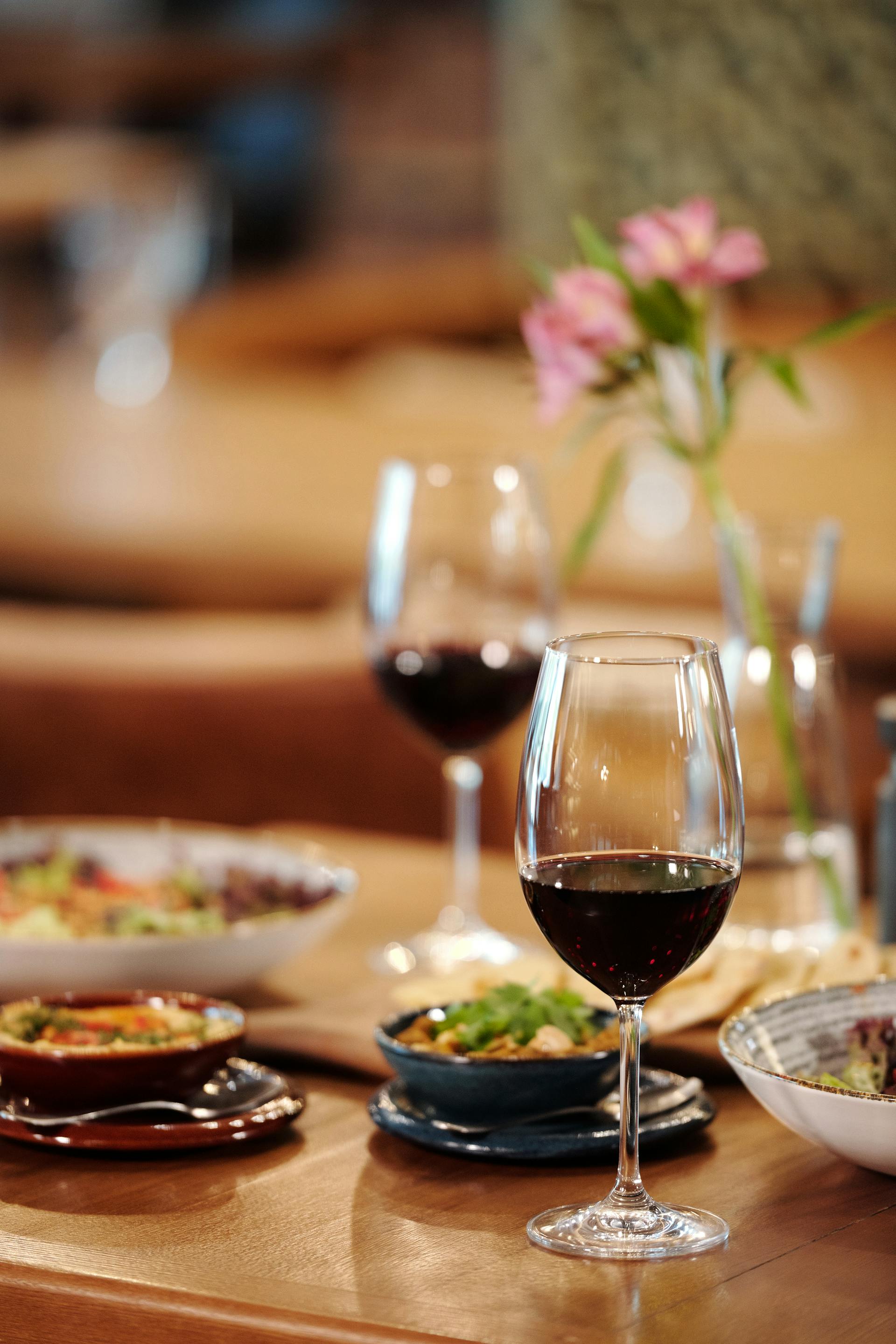 Wine glasses on a table | Source: Pexels