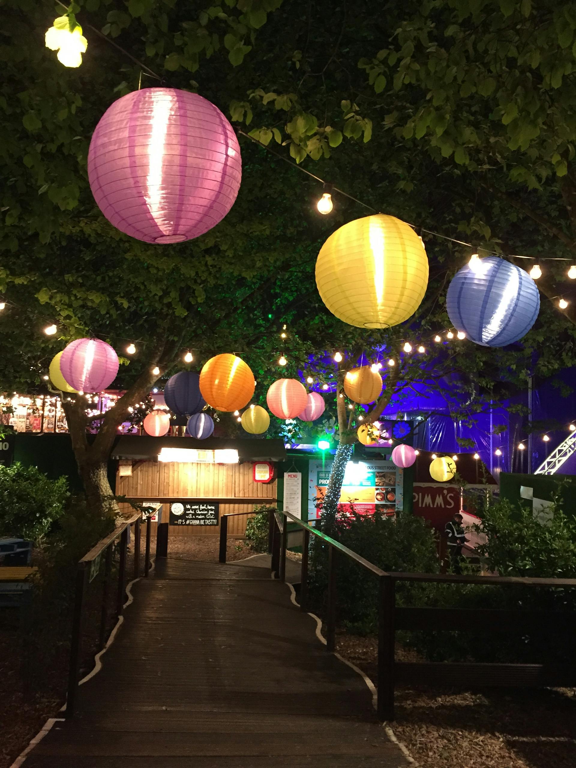 Assorted hanging paper lamps outside a house | Source: Pexels