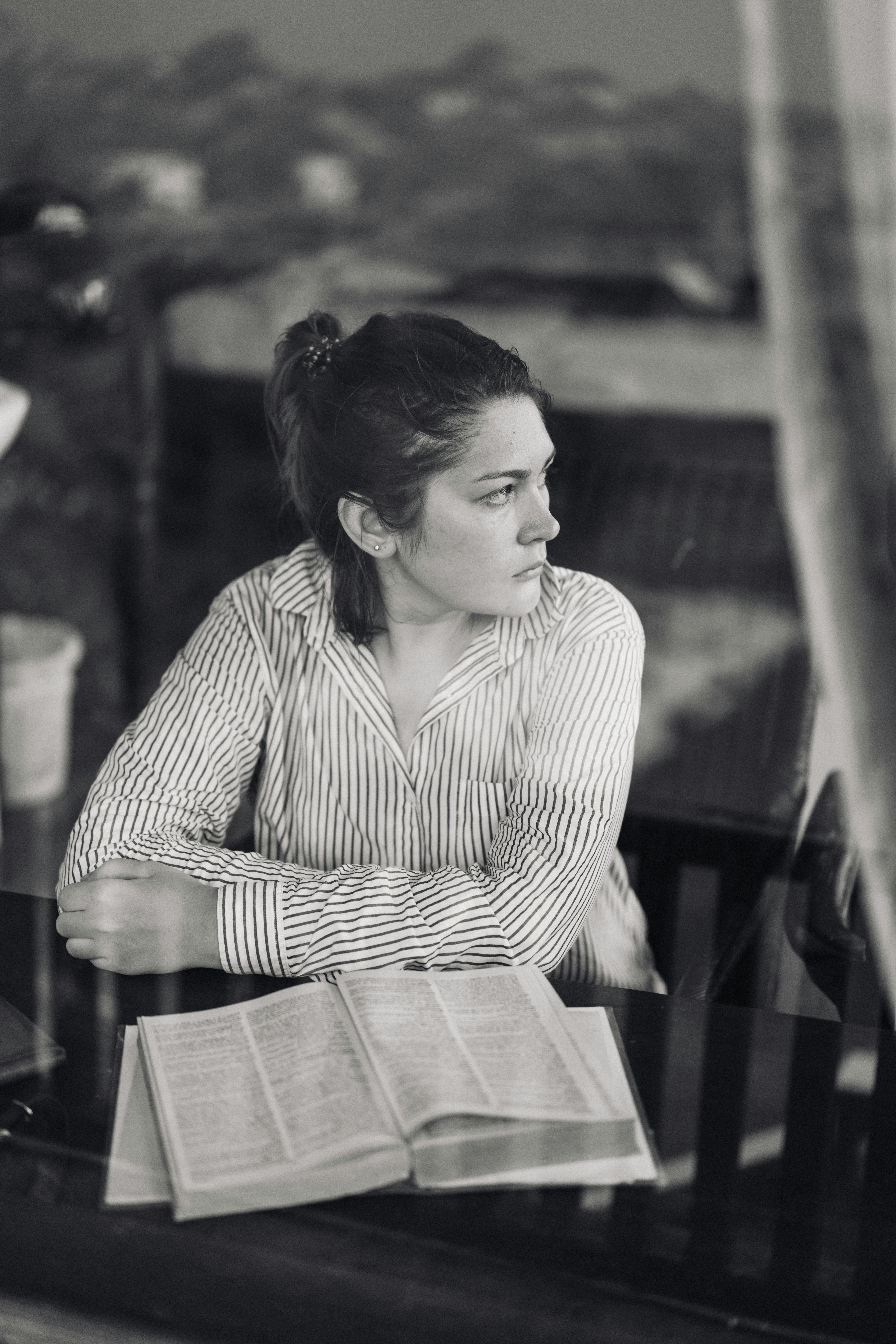 A serious woman seen through a window | Source: Pexels