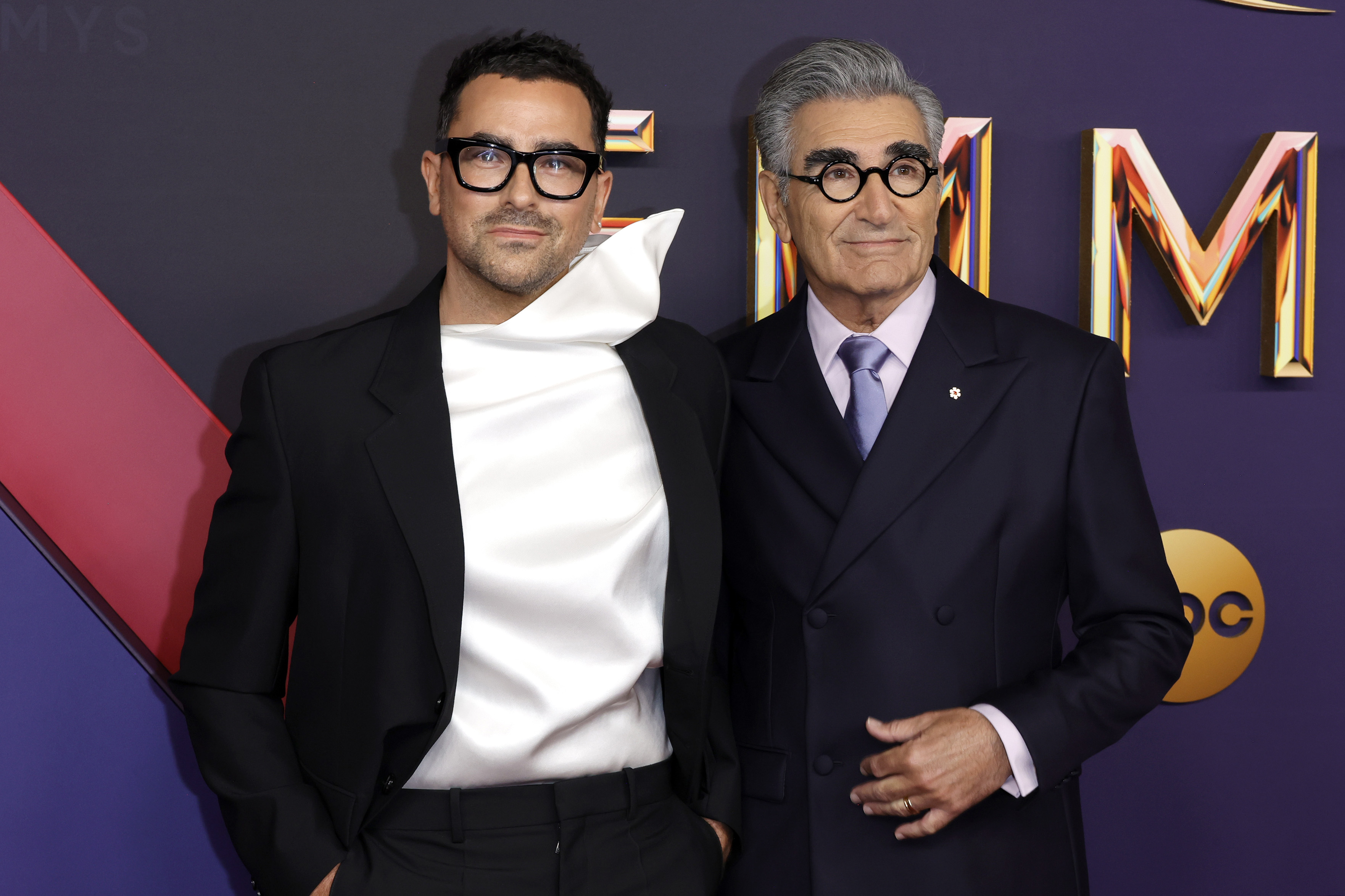 Dan Levy and Eugene Levy attend the 76th Primetime Emmy Awards at Peacock Theater on September 15, 2024 in Los Angeles, California. | Source: Getty Images