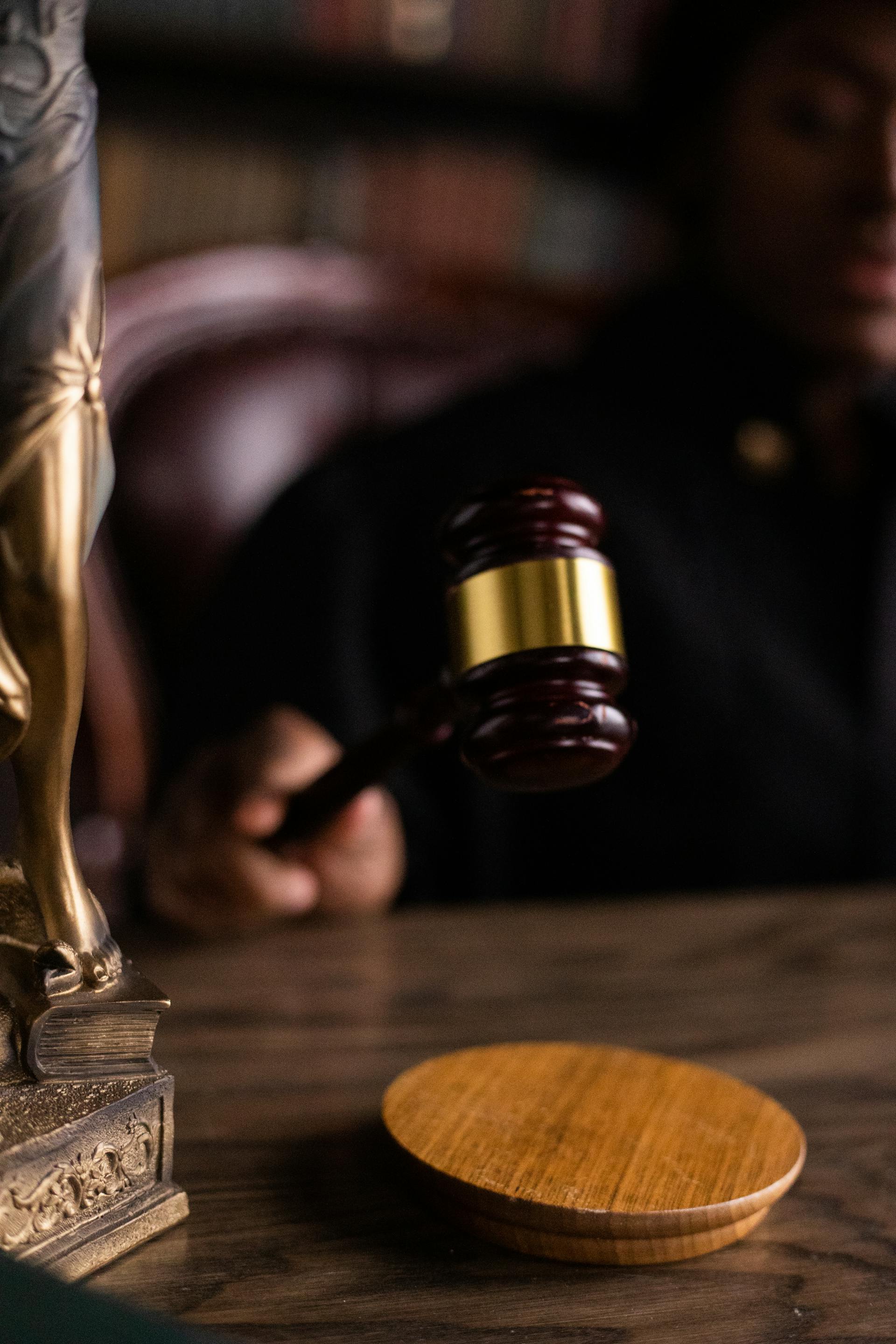 Close-up shot of a judge holding a gavel | Source: Pexels