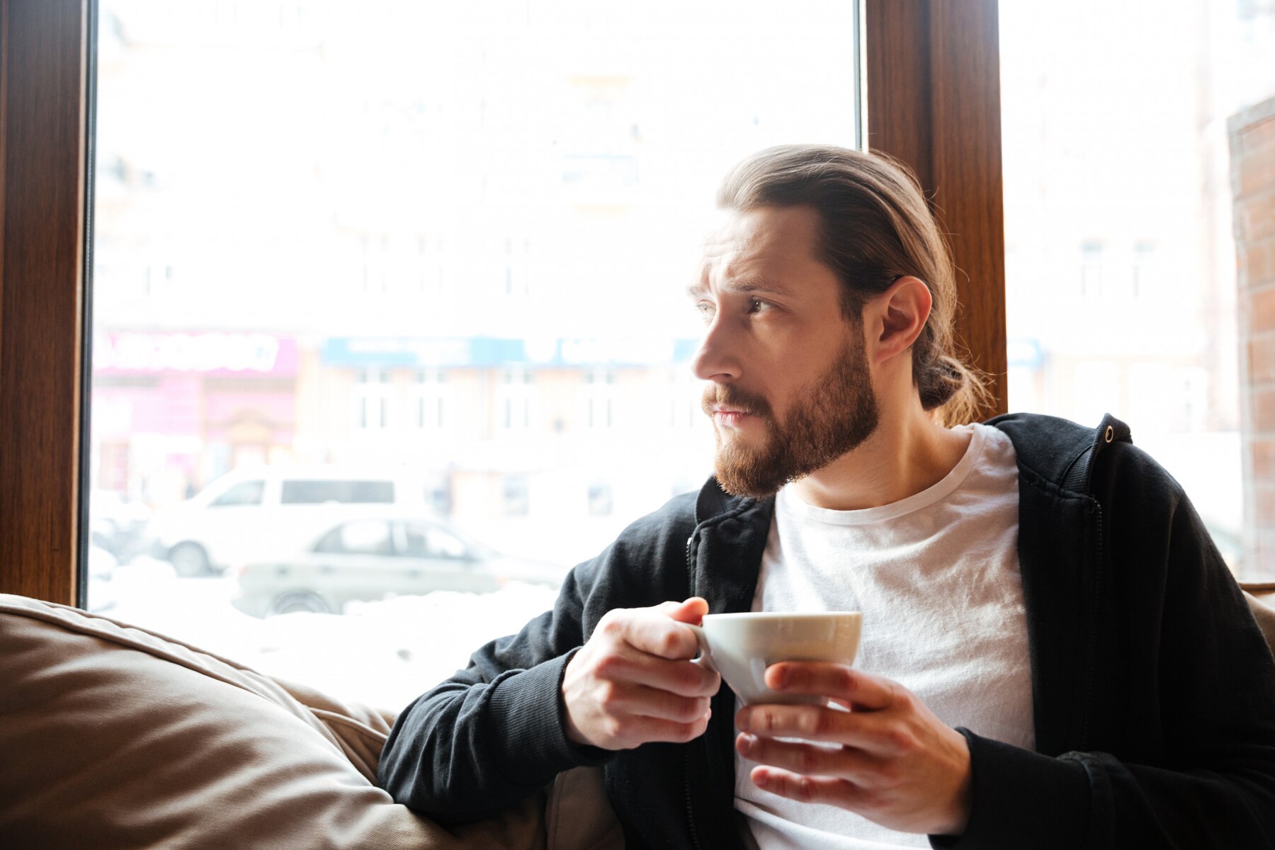 A sad thoughtful man in a cafe | Source: Freepik