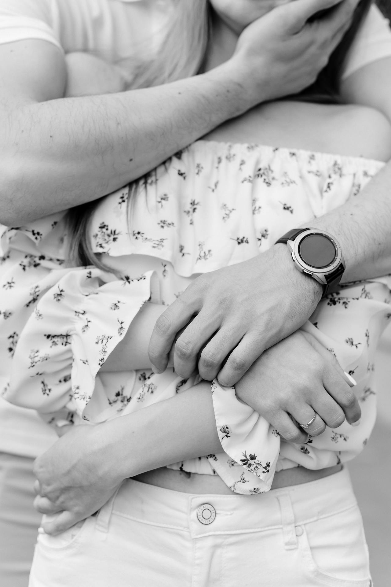 A man hugging his partner from behind | Source: Pexels