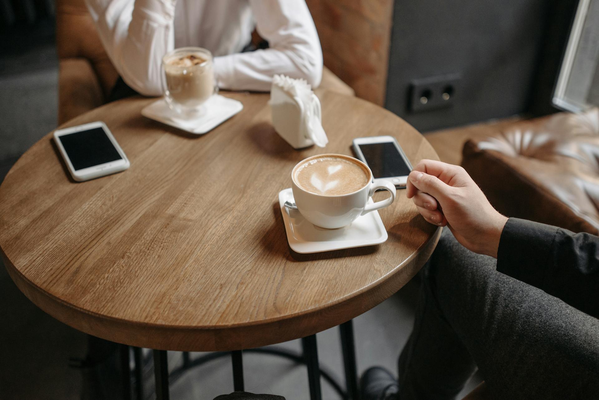 A close-up shot of a couple sitting in a café | Source: Pexels