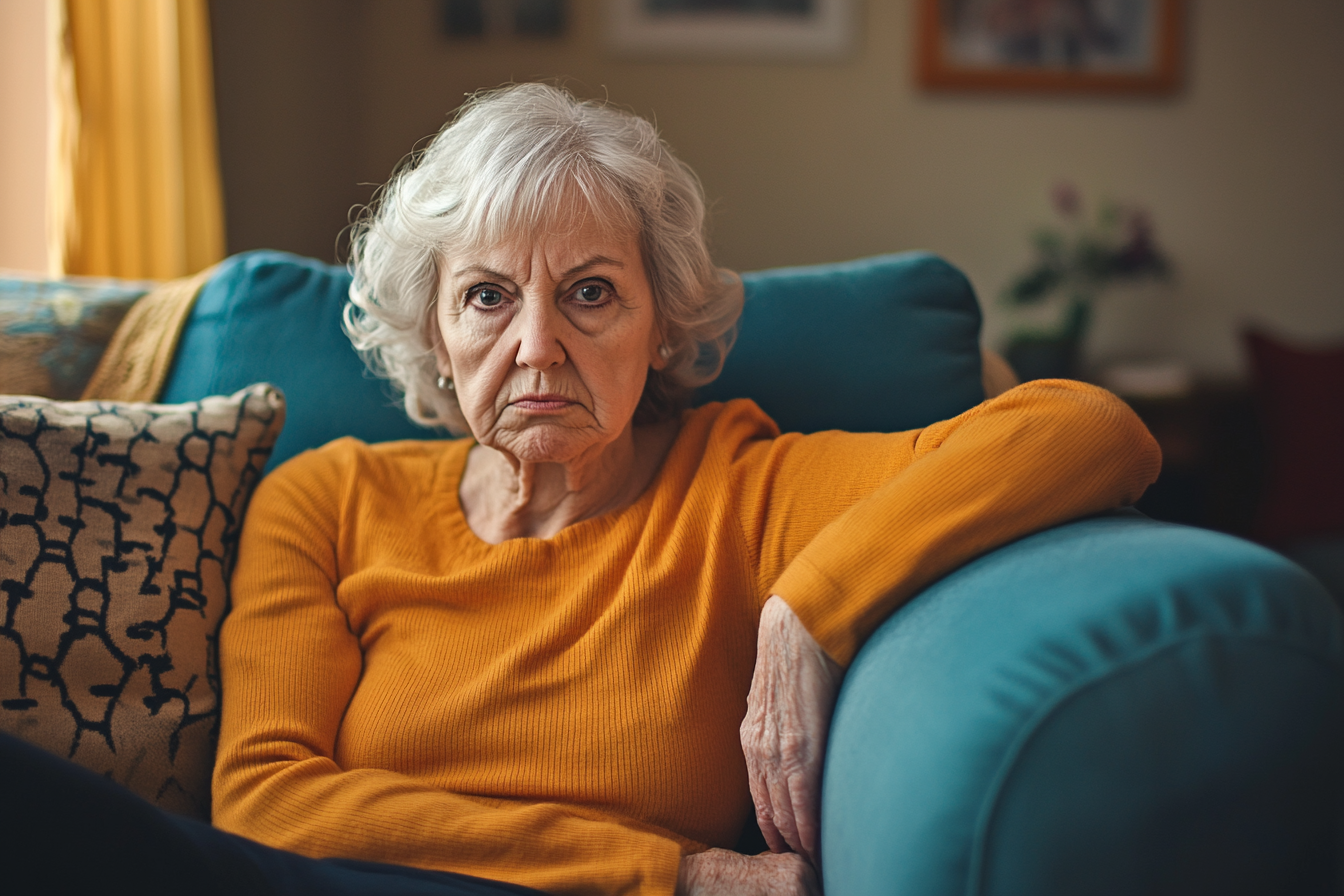 A scowling woman on a sofa | Source: Midjourney