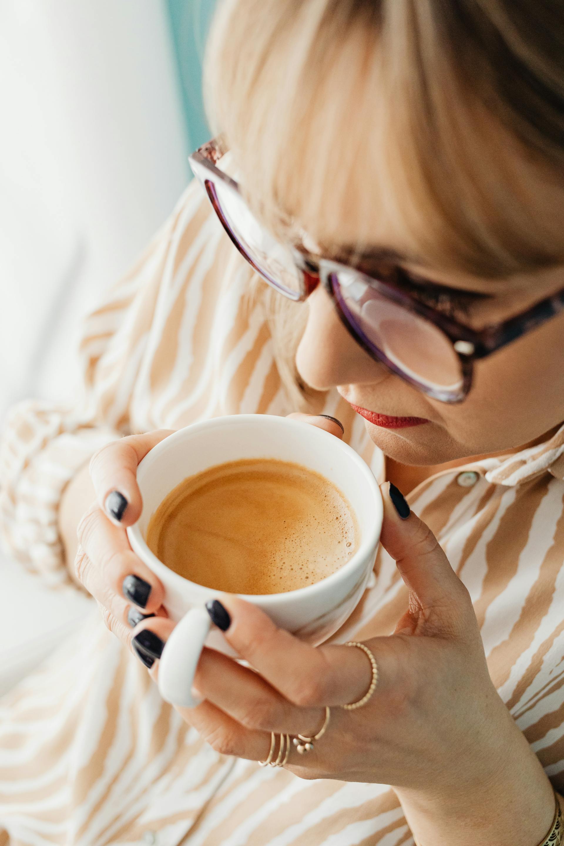 A woman drinking coffee  | Source: Pexels