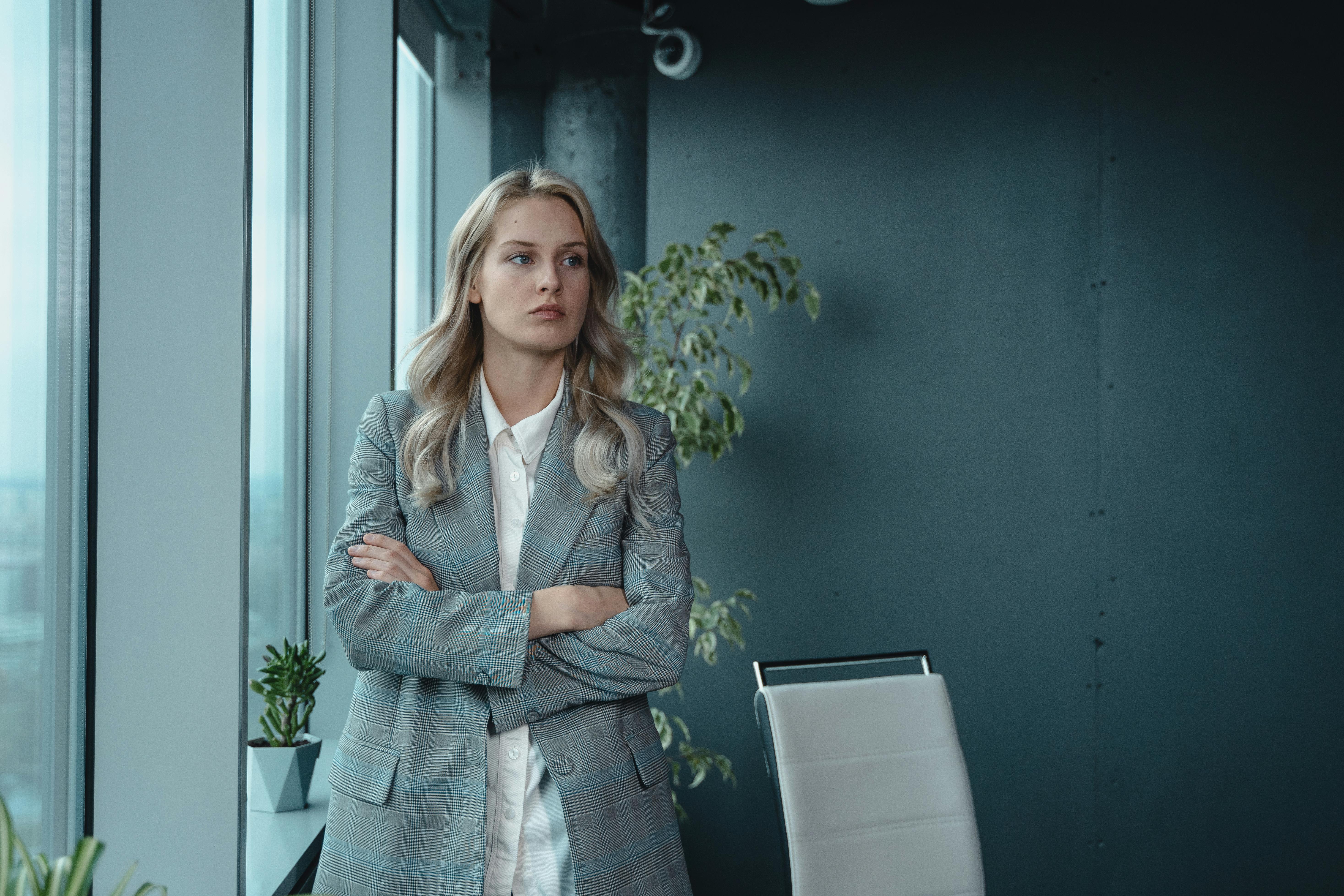 Woman standing in a boardroom | Source: Pexels