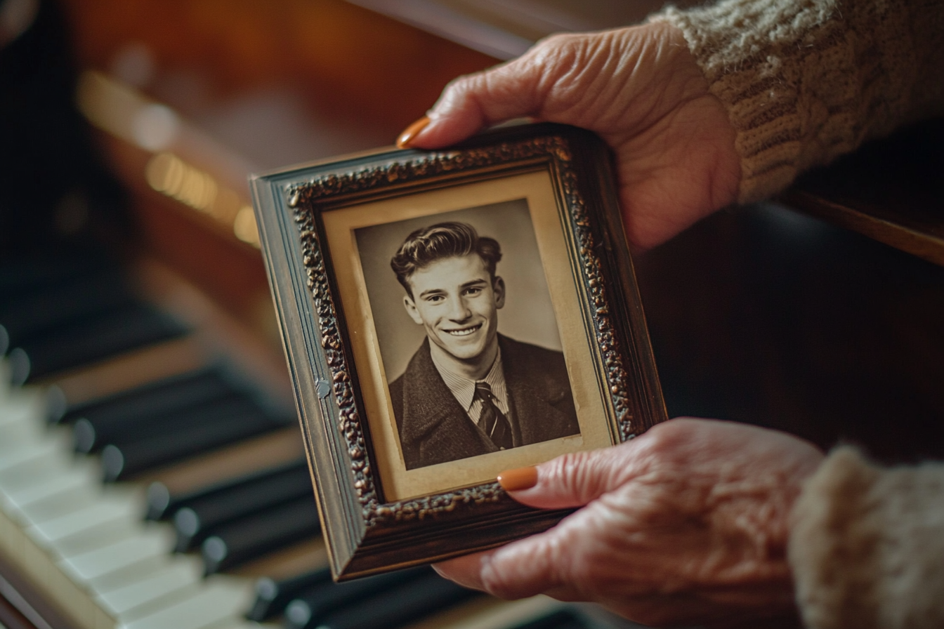 A woman holding an old photo | Source: Midjourney