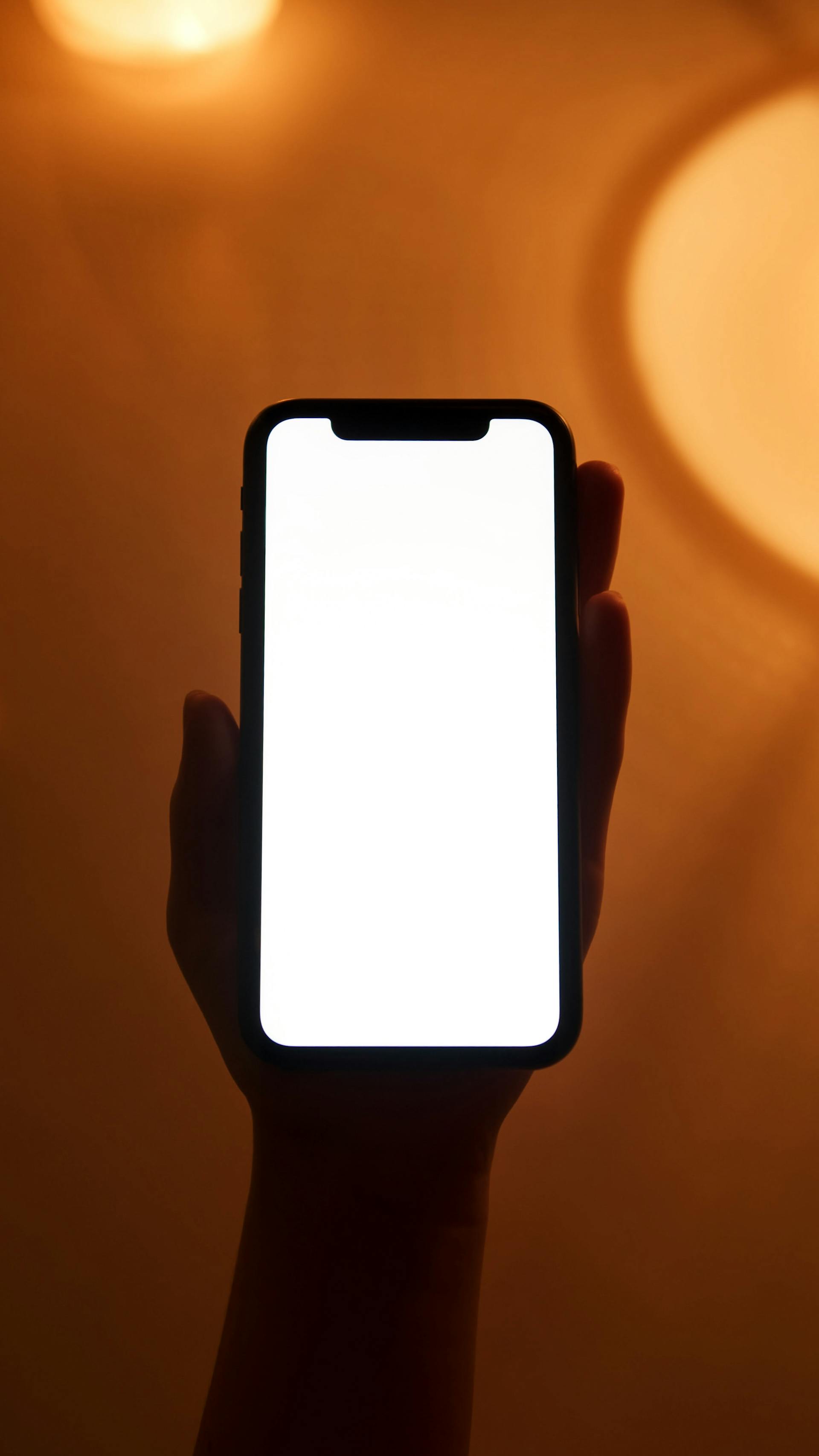 A person holding a cell phone | Source: Pexels