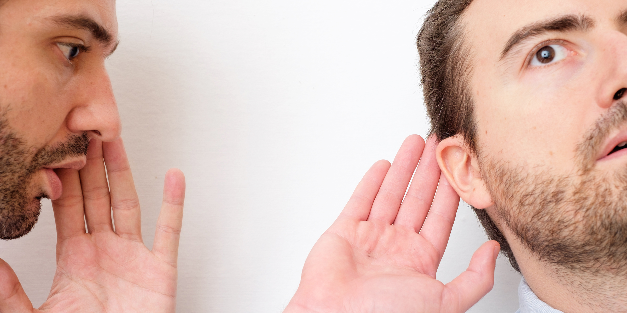 A man confessing a secret to his friend | Source: Shutterstock